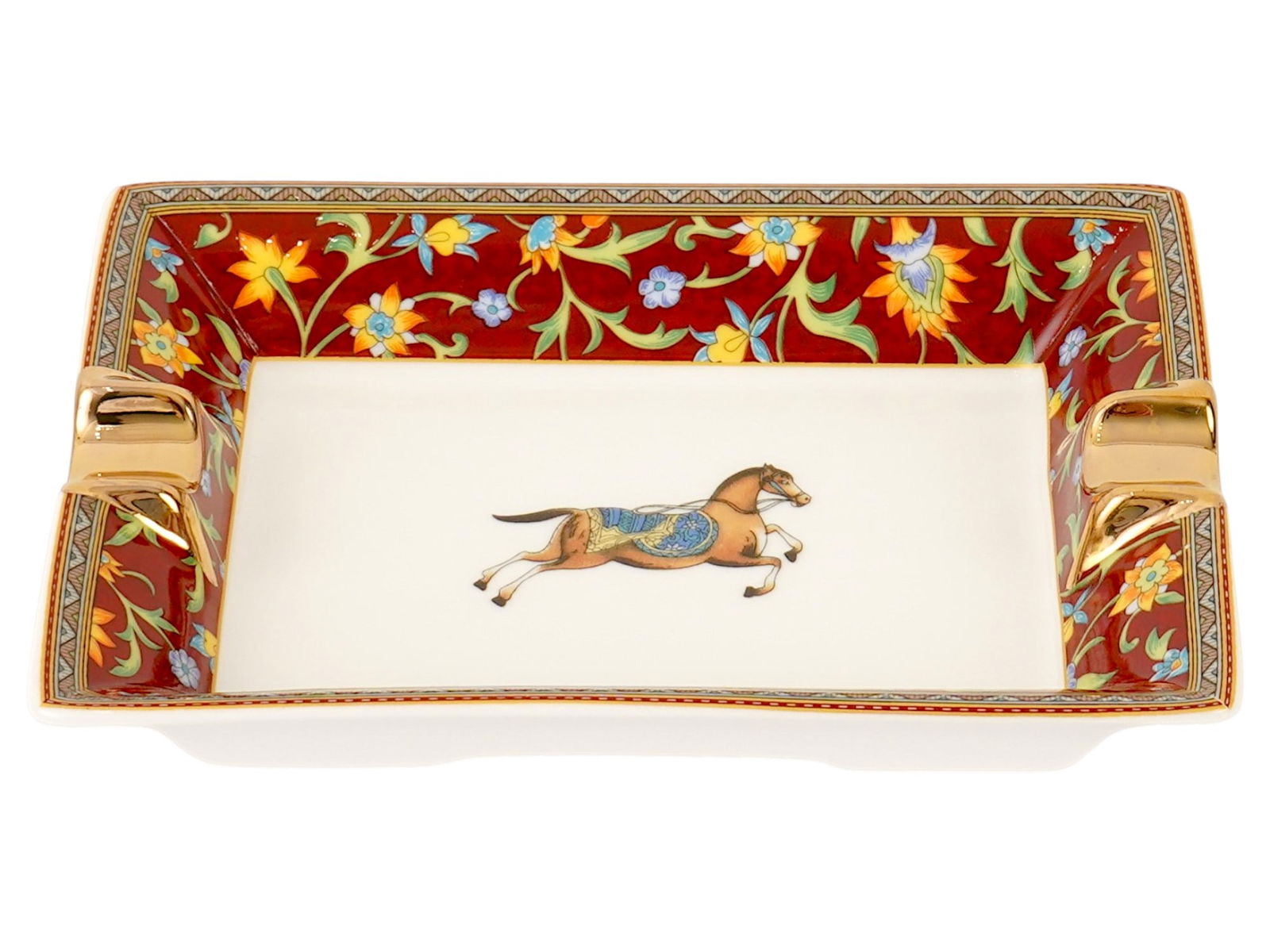 FRENCH HERMES CHEVAL D ORIENT PORCELAIN ASHTRAY: A vintage French Cheval dOrient porcelain ashtray by Hermes. Rectangular piece with two cigarette holders and transfer printed Cheval dOrient decoration with a red border and flower motifs. Marked on