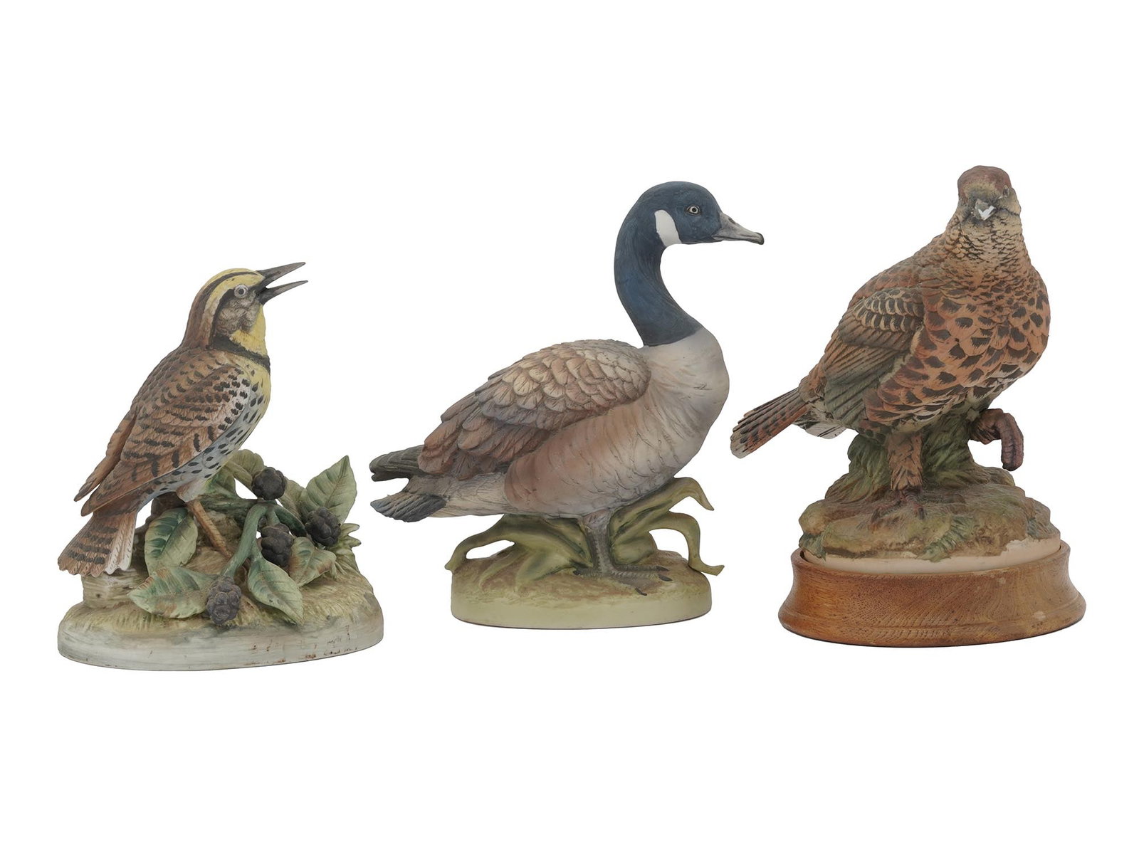 VINTAGE PORCELAIN ANDREA BY SADEK BIRD FIGURINES: Three vintage porcelain Andrea by Sadek bird figurines depicting a meadowlark, a spruce grouse, and a Canada goose. Each signed and labeled to the bottom. Circa the late 20th century. Andrea by