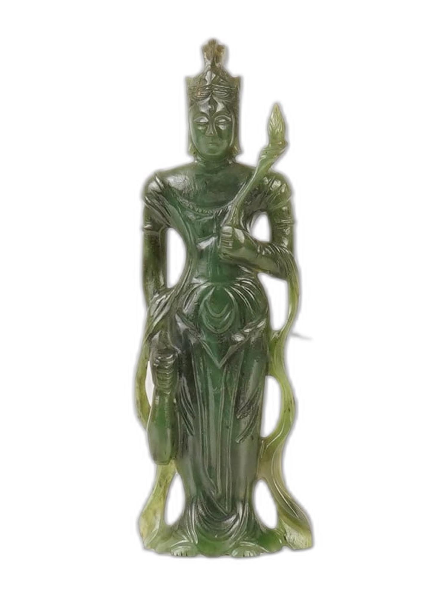 CHINESE BUDDHIST CARVED GREEN JADE FEMALE FIGURINE: A Chinese Buddhist carved green Jade figurine depicting a female character, often identified as deity or a mythological figure such as Guanyin or Yang Guifei. The figurine is distinguished by fine han