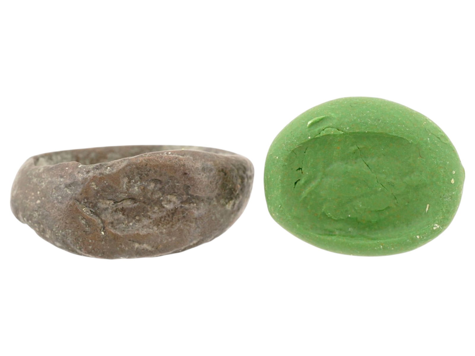 ANCIENT GRECO ROMAN BRONZE RING CA 200 BC TO 100 AD: An ancient Greco Roman bronze ring, ca. 200 BC to 100 AD. The ring has a simple band and a flat, oval shaped bezel. The bezel is adorned with an engraved portrait head image. Historical Archaeological