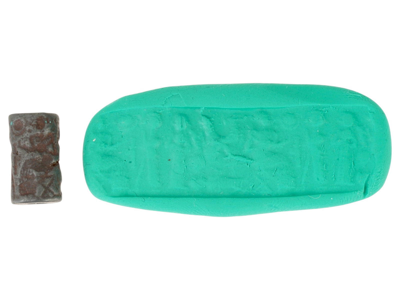 ANCIENT WESTERN ASIATIC CARVED HEMATITE BEAD: An ancient Western Asiatic carved hematite bead, dating to the 1st millennium BC. Engraved with a ritual scene. Carved from dark hematite, the bead features symbolic motifs connected to religious prac