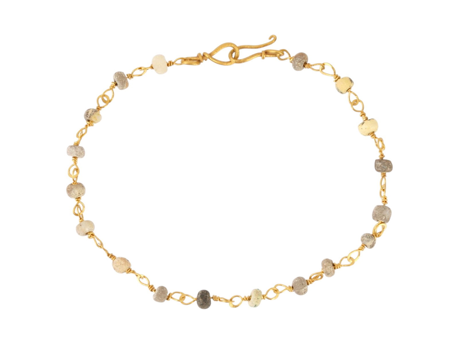 ANCIENT ROMAN GOLD BRACELET W GLASS BEADS 100 TO 300 AD: An ancient Roman Gold bracelet. The bracelet is made in a chain design and decorated with glass beads. A hook clasp. Circa: 100 to 300 AD. Ancient Roman Gold and Glass Jewelry Wares and Accessories, M