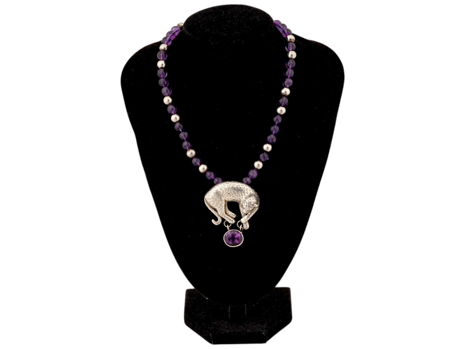 CAROL FELLEY STERLING SILVER & AMETHYST LEOPARD NECKLACE: A striking vintage sterling silver and amethyst necklace by acclaimed Southwestern jewelry designer Carol Felley. The focal point is a beautifully detailed cast sterling silver leopard with a textured