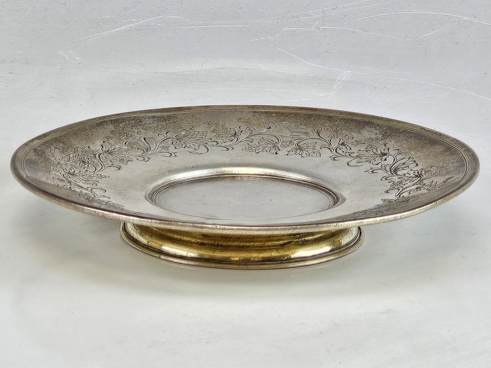 ANTIQUE 19TH C RUSSIAN SILVER FRUIT OR CANDY DISH: An antique 19th century Russian silver fruit or candy dish. The round, slightly recessed dish is raised on a base and decorated with an engraved floral pattern around the rim. Hallmark of 84 silver