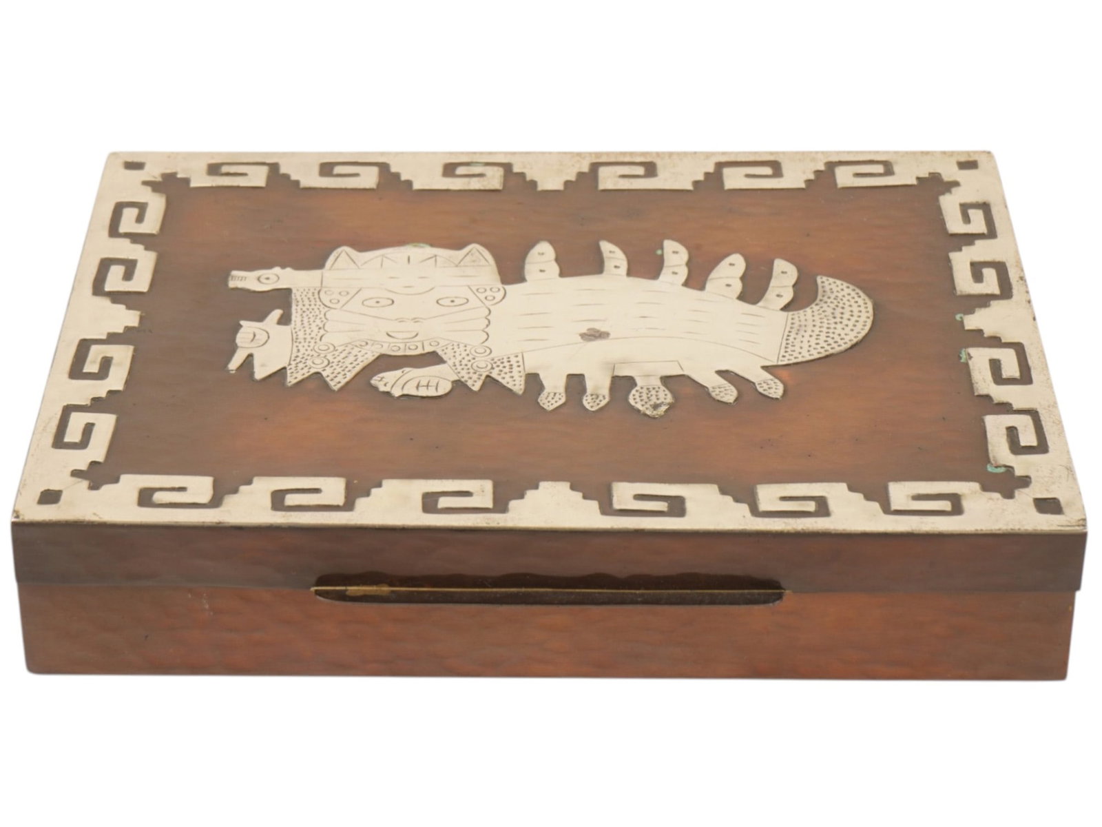 PERUVIAN VICKY COPPER AND STERLING SILVER BOX: A vintage Peruvian Vicky Industria hammered copper and sterling silver box. The rectangular box is decorated with traditional Peruvian sterling silver patterns applied to the lid along the edge and a