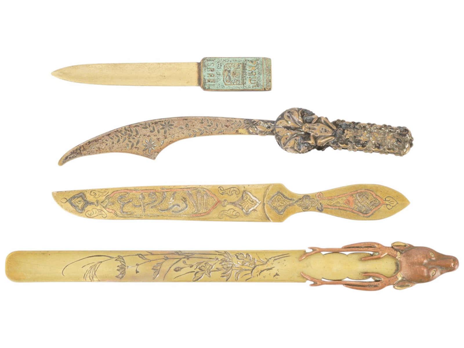 GROUP OF FOUR DECORATIVE ENGRAVED LETTER OPENERS: A group of four letter openers features varied stylistic influences, including a brass letter opener with the inscription ISRAEL and the coat of arms on the handle. Similar items were produced in Isra
