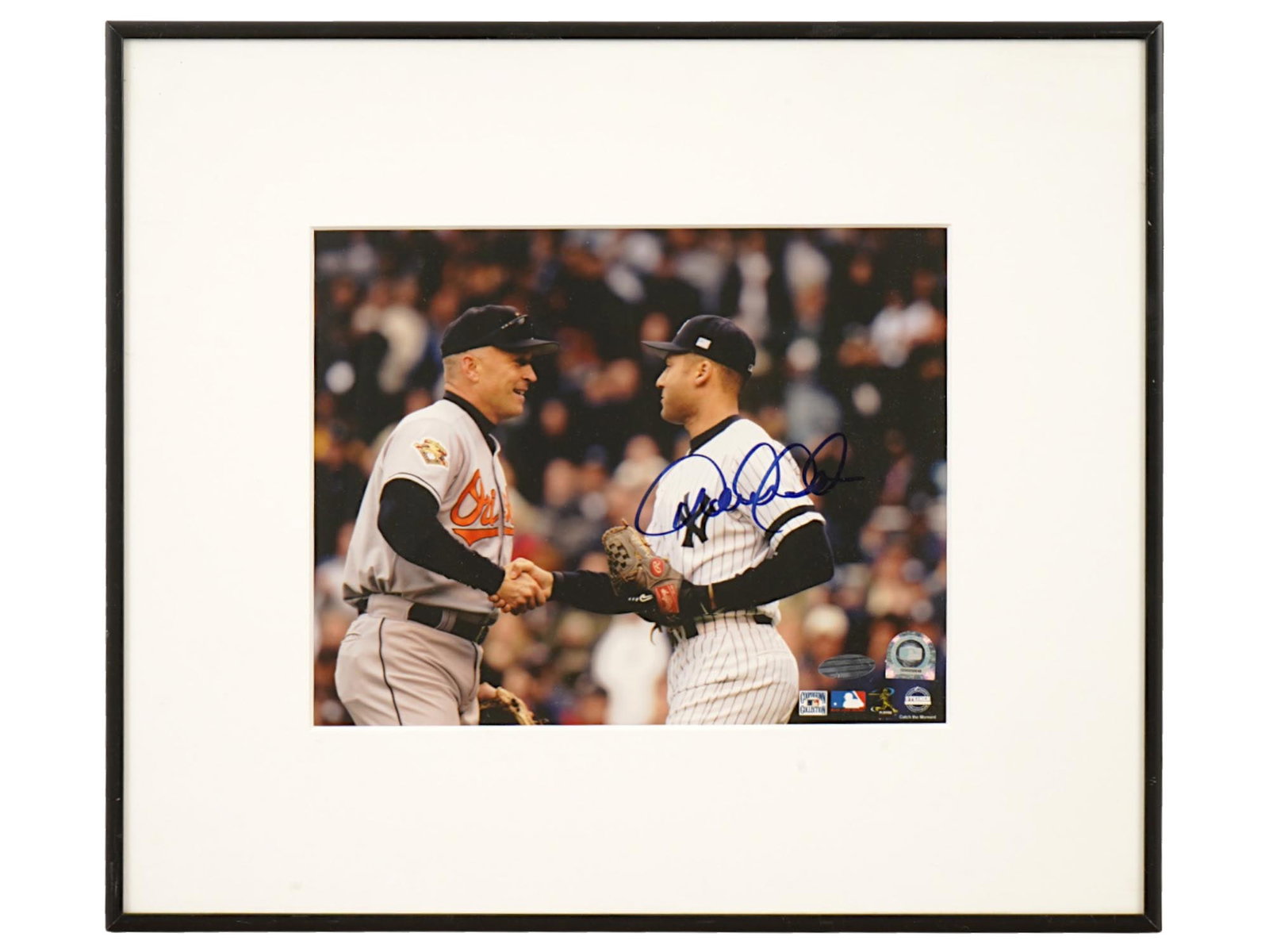 DEREK JETER SIGNED PHOTO MLB STEINER AUTH: A professional photograph signed by New York Yankees captain Derek Jeter. The piece carries both MLB Authentication and Steiner Sports tamper-evident holograms for absolute provenance. The Captain,