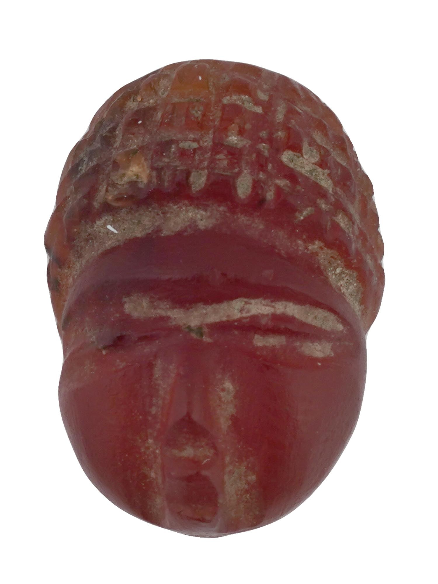 ANCIENT SASANIAN CARVED AGATE HEAD INTAGLIO BEAD: An ancient Sasanian hand carved red agate intaglio bead. The bead depicts a head with a high hairstyle. Ancient Sasanian Jewelry Wares and Accessories and Collectibles. THIS LOT IS ELIGIBLE FOR