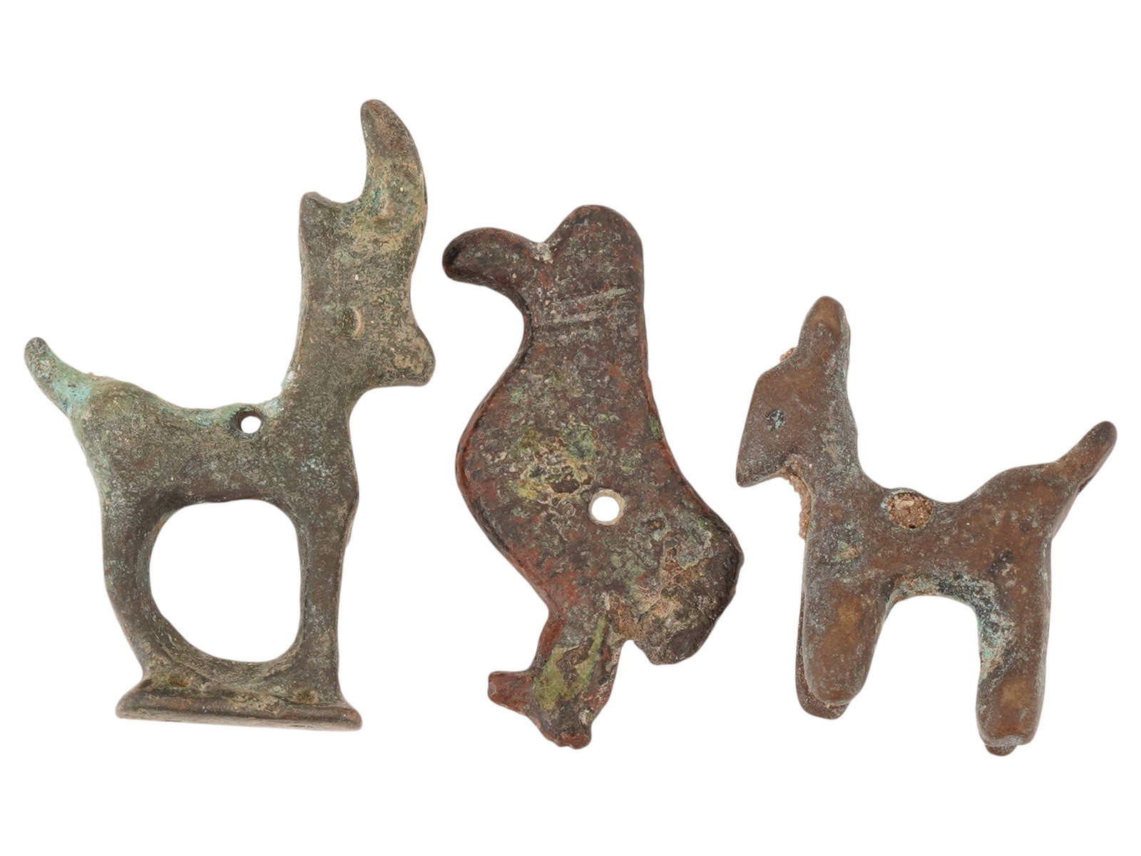 GROUP OF THREE ANCIENT LURISTAN BRONZE ANIMAL FIGURES: A group of three ancient Luristan bronze animal figures dating circa 600 to 400 BC, originating from the mountainous region of western Iran. Characteristic of Luristan metalwork, these stylized zoomor