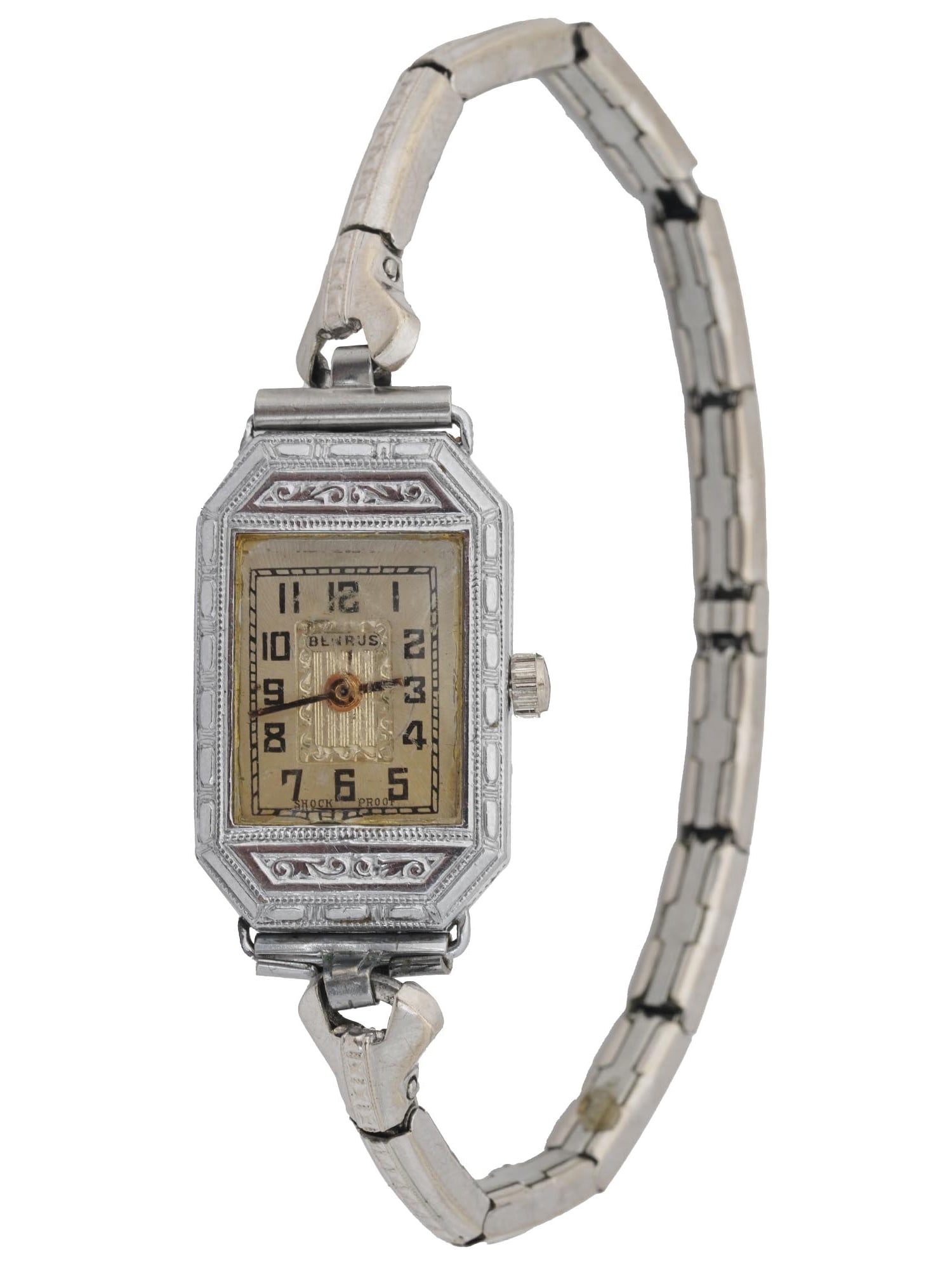 14K WHITE GOLD BENRUS ENGRAVED LADIES WRIST WATCH: A 14K White Gold Benrus ladies wrist watch. Shock Proof. A gold enameled dial with black numerals and hands. The dial is engraved with a scrollwork motif to the center. The wrist watch is adorned
