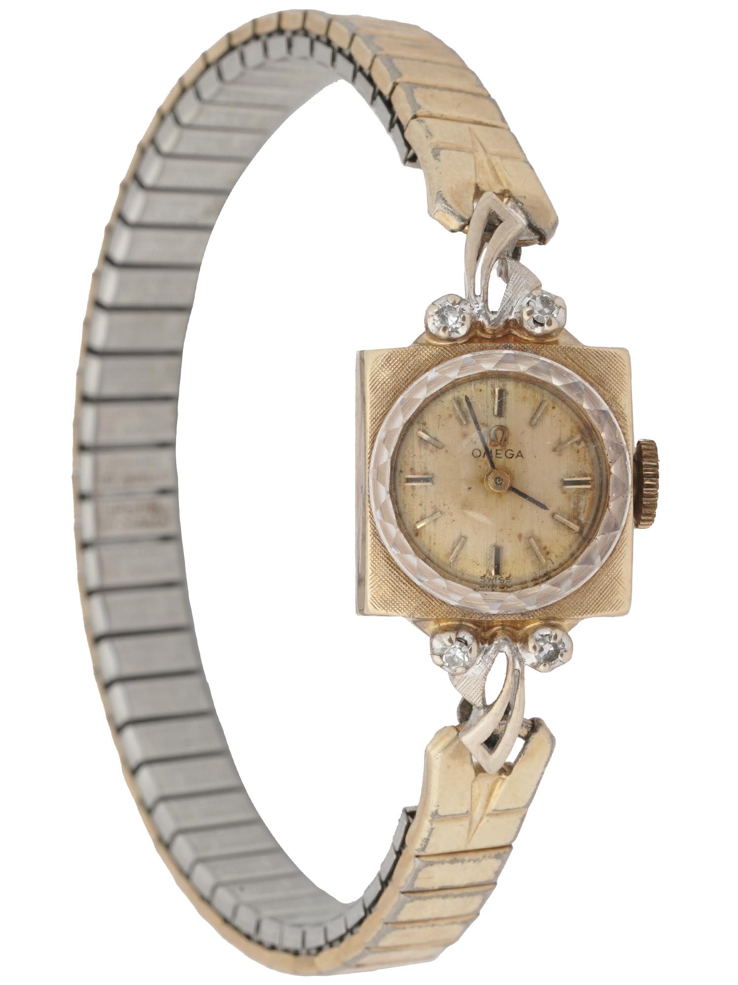 14K GOLD AND DIAMONDS OMEGA LADIES WRIST WATCH: A 14K Gold Omega ladies wrist watch. Swiss made. A gold tone dial with gold tone numerals and black hands. The corps is adorned with an engraved design and encrusted with diamonds. The bracelet is