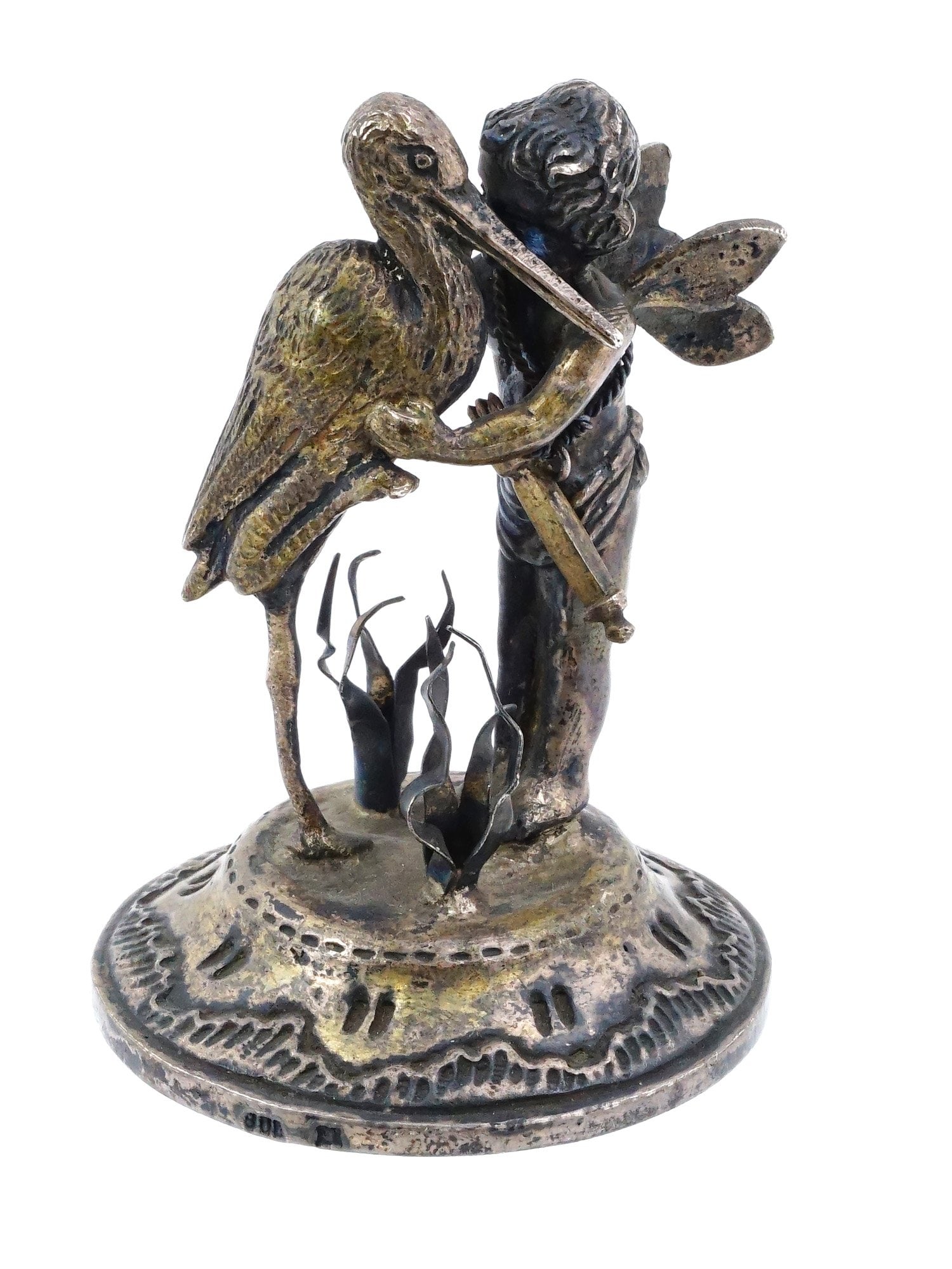 VINTAGE STERLING SILVER FIGURINE OF CUPID AND A STORK: A vintage sterling silver figurine of Cupid and a Stork. The composition depicts a winged Cupid embracing a stork. This theme often symbolizes love, birth, and family, as both figures are iconic in