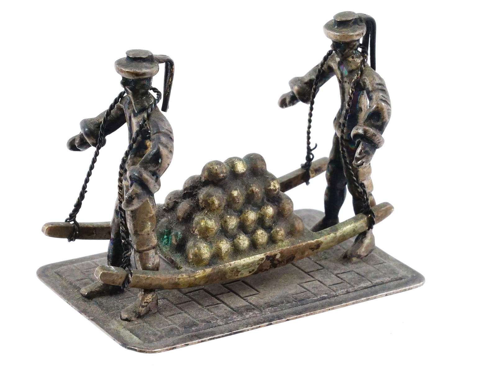 ANTIQUE MINIATURE SILVER FIGURINE DUTCH CHEESE PORTERS: An antique miniature silver figurine depicting two Dutch cheese porters, inspired by the historic cheese market of Alkmaar. The figures wear traditional attire with wide-brimmed hats and shoulder