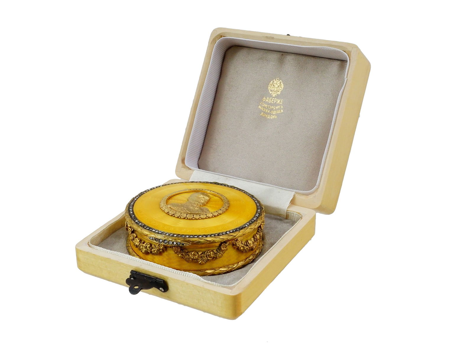 RUSSIAN SILVER ENAMEL ROUND TOBACCO BOX WITH DIAMONDS: A Russian silver and enamel round tobacco box. The lid is centered with a portrait of Tsar Nicholas II in military uniform, set against a guilloche enamel ground. The border of the lid is adorned with