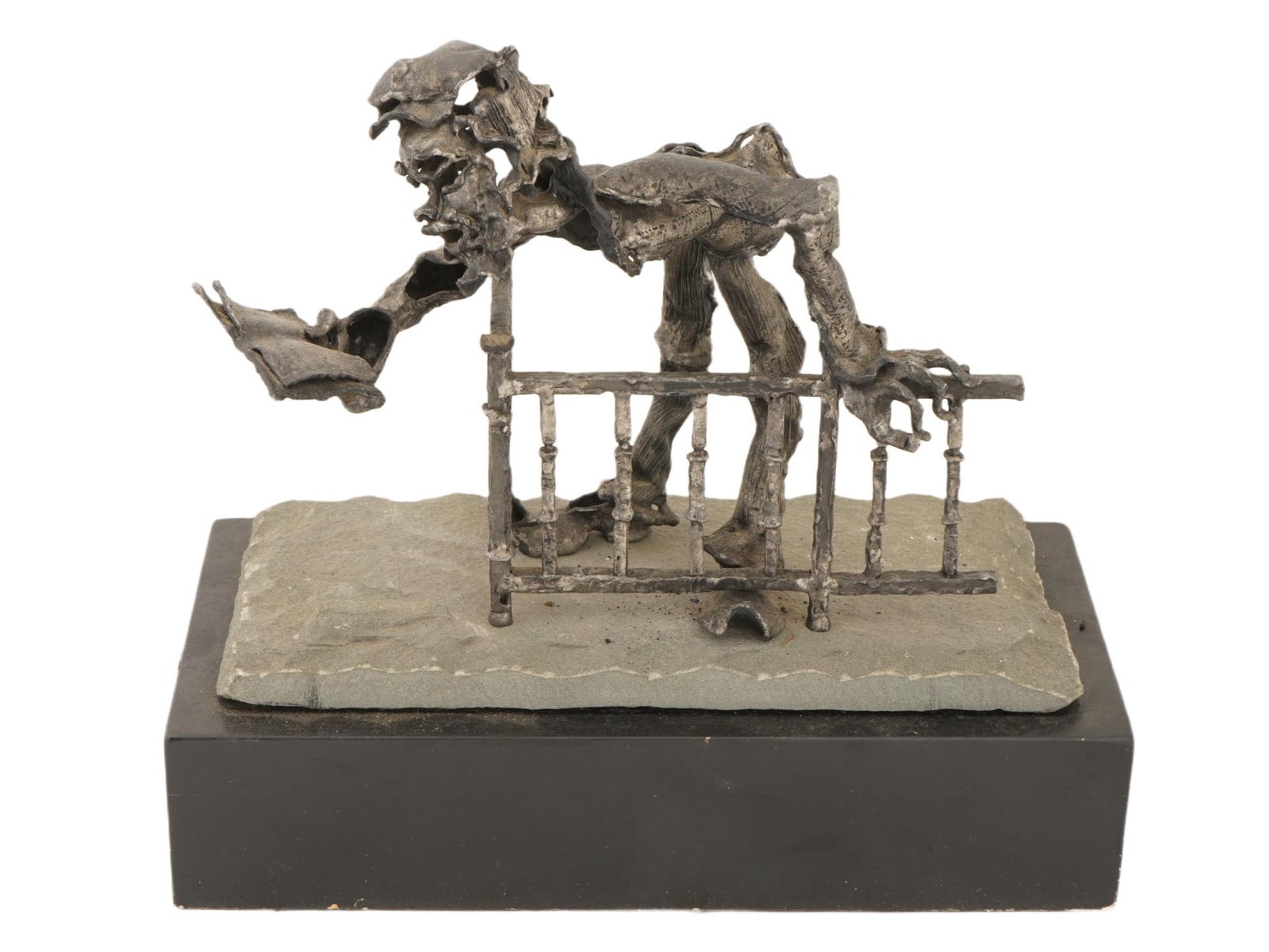 BRONZE SCULPTURE OF A RABBI BY NORMAN RABINOWITZ: A bronze sculpture depicting a Rabbi by Norman Rabinowitz, American, 1917 to 2010. Executed in a modernist, abstract, and brutalist style for which the artist is well known. The figural form, often in