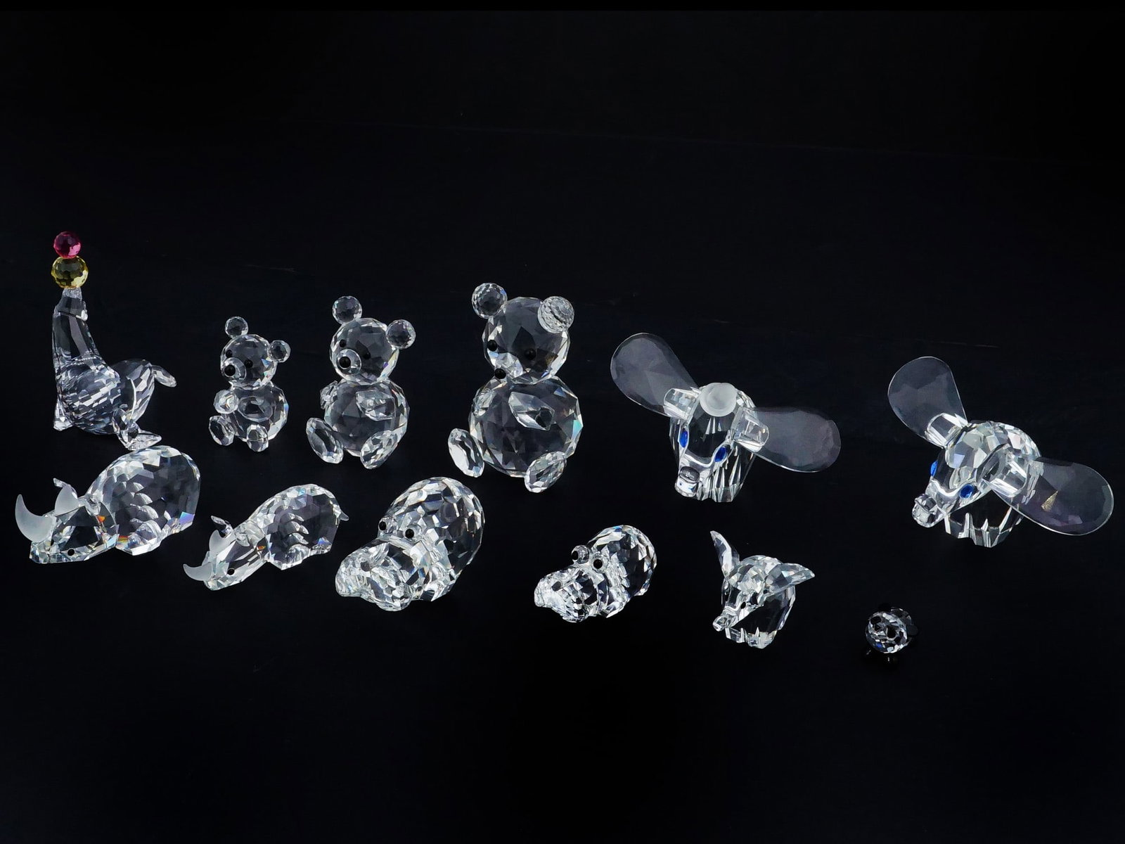 VINTAGE SWAROVSKI FACETED CRYSTAL ANIMAL FIGURINES: A collection of vintage faceted crystal animal figurines from the Swarovski Silver Crystal line, designed in the late 20th century by noted Swarovski artists including Max Schreck and Adi Stocker. Hig