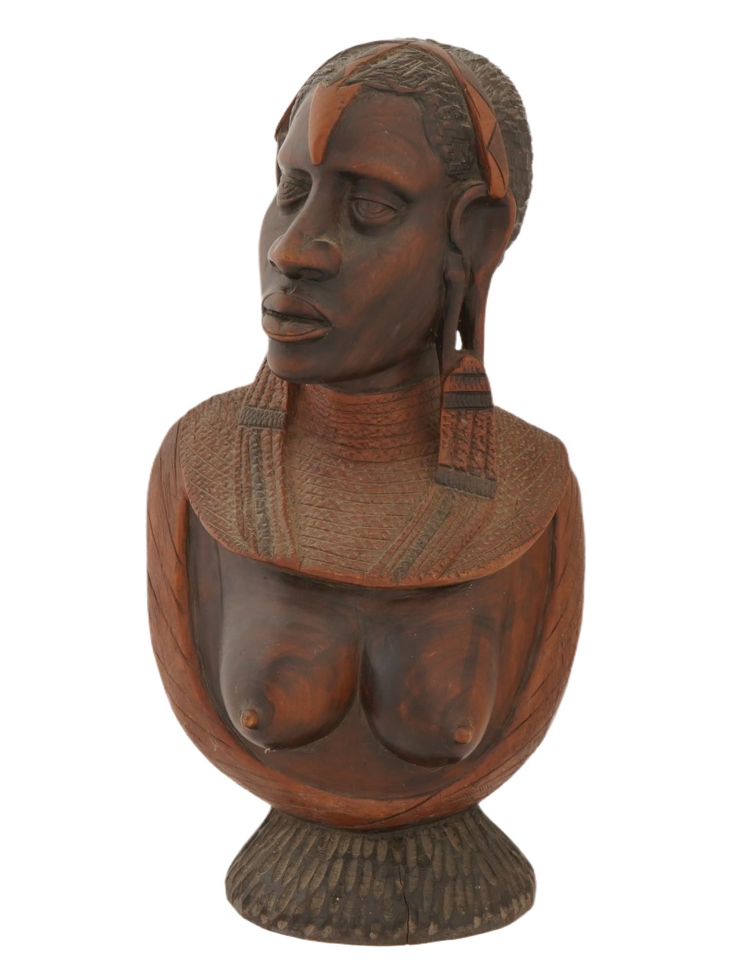 HAND CARVED WOODEN TRIBAL BUST OF AFRICAN WOMAN: A hand carved wooden bust of African woman. The bust is engraved with facial features, head and neck decorations, and a nude breast. Mounted on a textures stand. Vintage African Hand Carved Wooden Bus