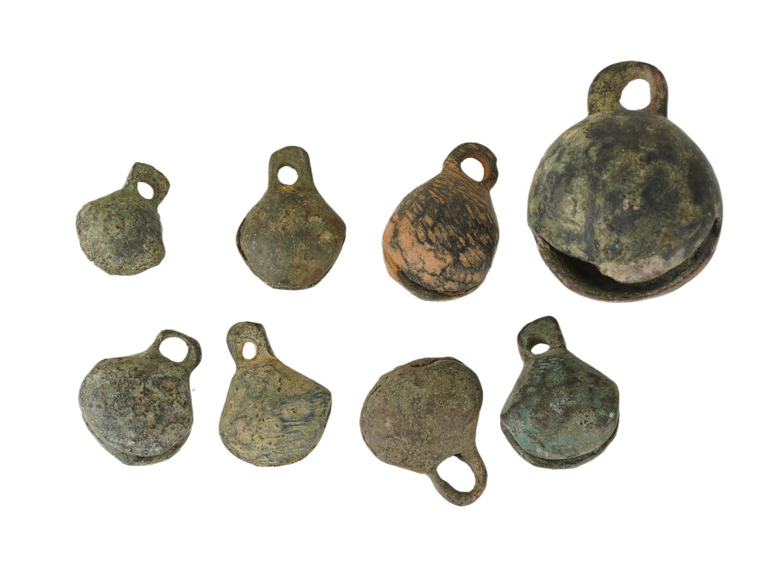 LOT OF ROMAN BYZANTINE BRONZE BELLS 300 TO 600 AD: A collection of eight ancient Roman Byzantine Empire bronze bells dating from 300 to 600 AD. The collection includes eight bells of various sizes. The wares are decorated with the loops for suspension
