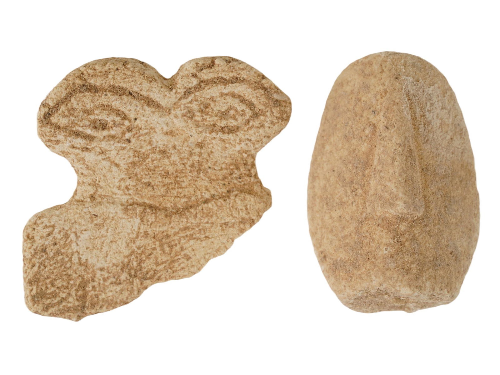 ANCIENT WEST ASIATIC STONE VOTIVE IDOLS 2ND MILLENIUM BC: A lot of two ancient West Asiatic carved stone eye idol sculptural fragments. Shaped like a weight surmounted by two eyes, much scholarly design has been proposed about their meanings. These so called