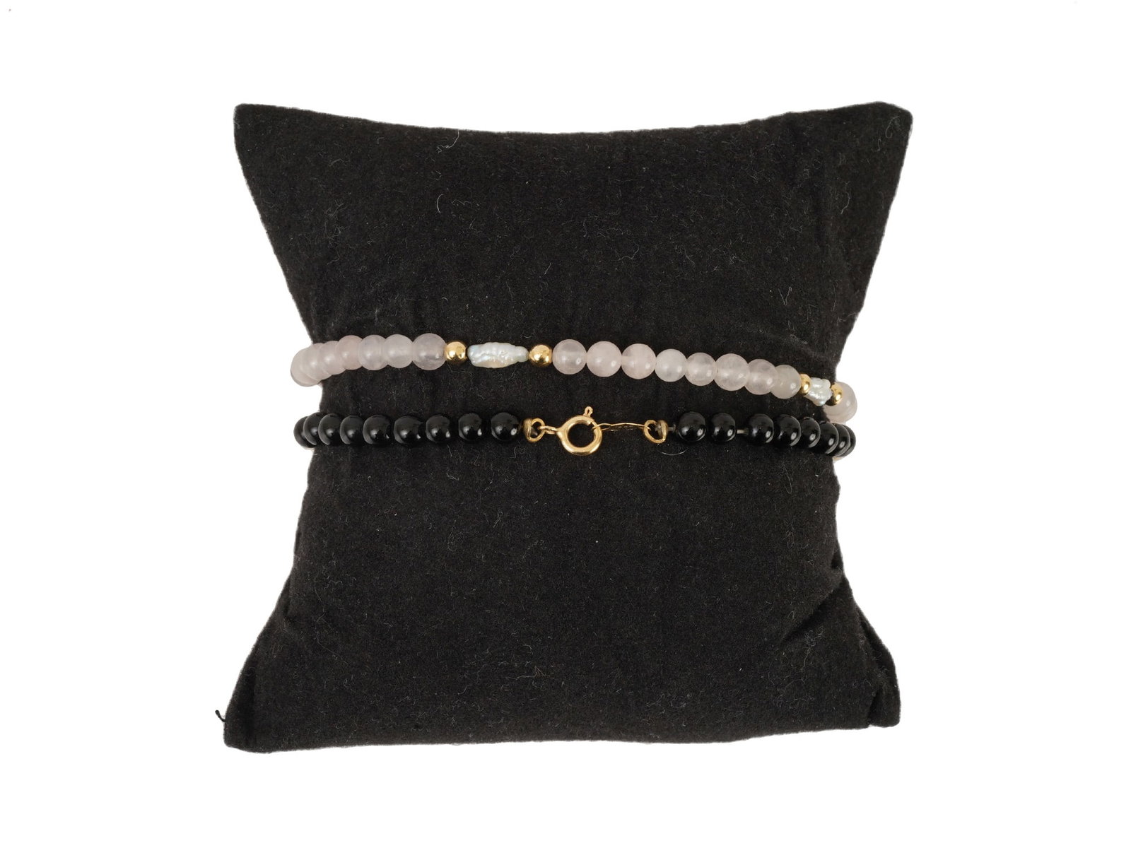 LOT OF 14K GOLD AND GEMSTONE JEWELRY BRACELETS: A lot of two 14K Gold jewelry bracelets. Each bracelet is made in a beaded design. The bracelet are made of stones in various shades and Gold beads. Marked with a Gold standard hallmark, on a clasp. L