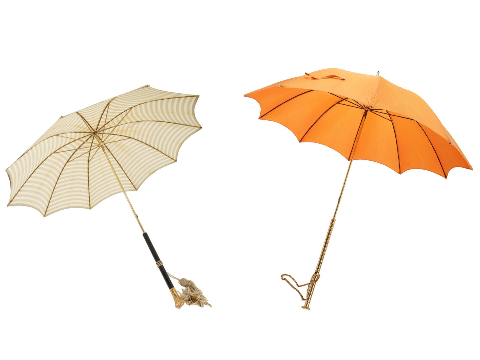 LOT OF VINTAGE UMBRELLAS W DECORATIVE CANE HANDLES: A lot of two vintage cane style umbrellas with decorative handles. The first: one light striped with a decorative handle featuring engraved floral, foliage and foliate scroll ornaments on a tip and a