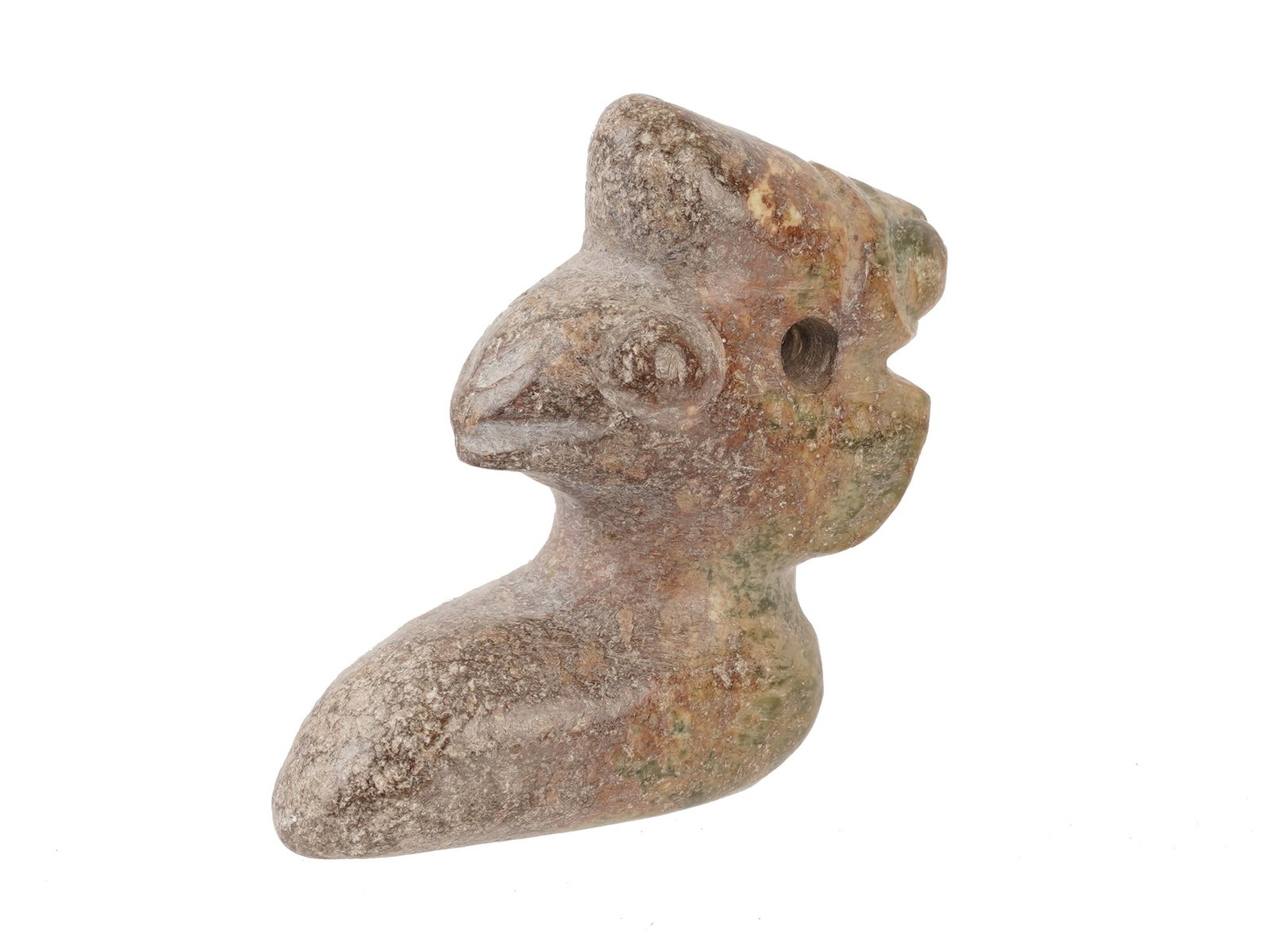 CHINESE CARVED JADE FIGURAL PENDANT AMULET OF BIRD: A Chinese carved Jade figural pendant amulet. The ware is carved from a Nephrite Jade stone, depicting a stylized bird with a prominent crest and hooked beak. The piece features a central biconical pe