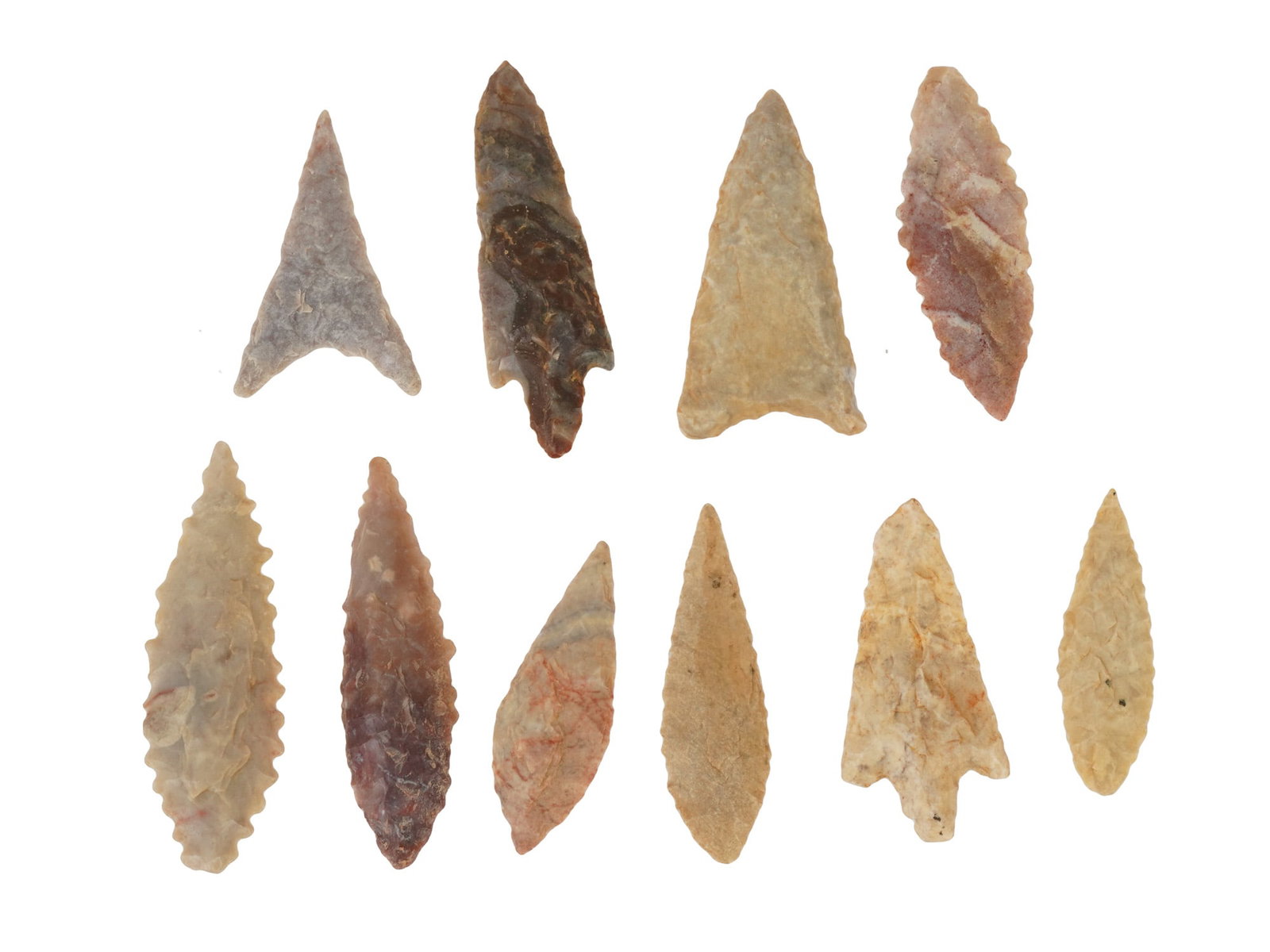 COLLECTION OF HAND CARVED STONE POINTS ARROW HEADS: A collection of ten hand carved stone points that were used by ancient people as arrowheads, darts or spearheads. The pieces are made from flint and other hard stones such as agate using the technique