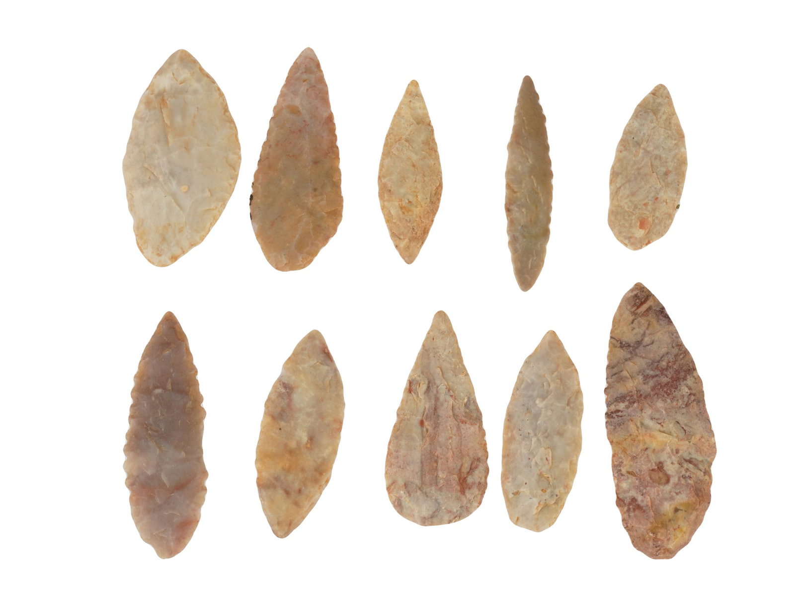COLLECTION OF HAND CARVED STONE POINTS ARROW HEADS: A collection of ten hand carved stone points that were used by ancient people as arrowheads, darts or spearheads. The pieces are made from flint and other hard stones such as agate using the technique