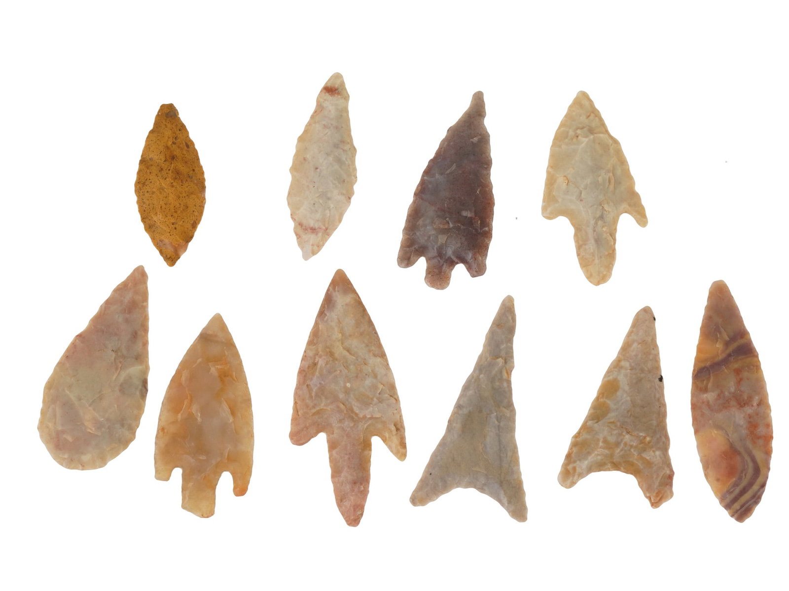 COLLECTION OF TEN ANCIENT ASSORTED STONE ARROWHEADS: A collection of ten ancient assorted stone arrowheads featuring a variety of bifacial flaking techniques and morphological styles. The collection includes stemmed, corner-notched, and lanceolate forms