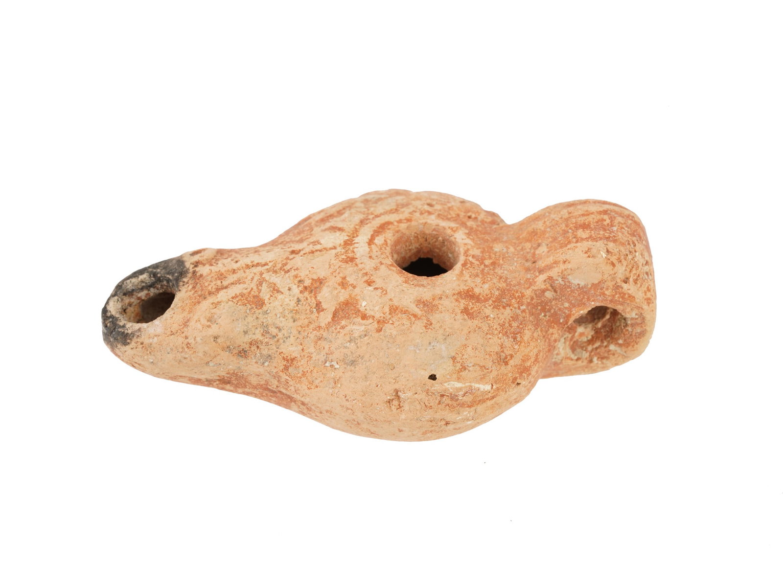 ANCIENT ROMAN TERRACOTTA OIL LAMP W RAISED LEAF MOTIFS: An ancient Roman terracotta oil lamp, dating to approximately 100 to 300 AD and featuring a classic molded form with a rounded body, central filling hole, and a projecting spout for the wick. The side