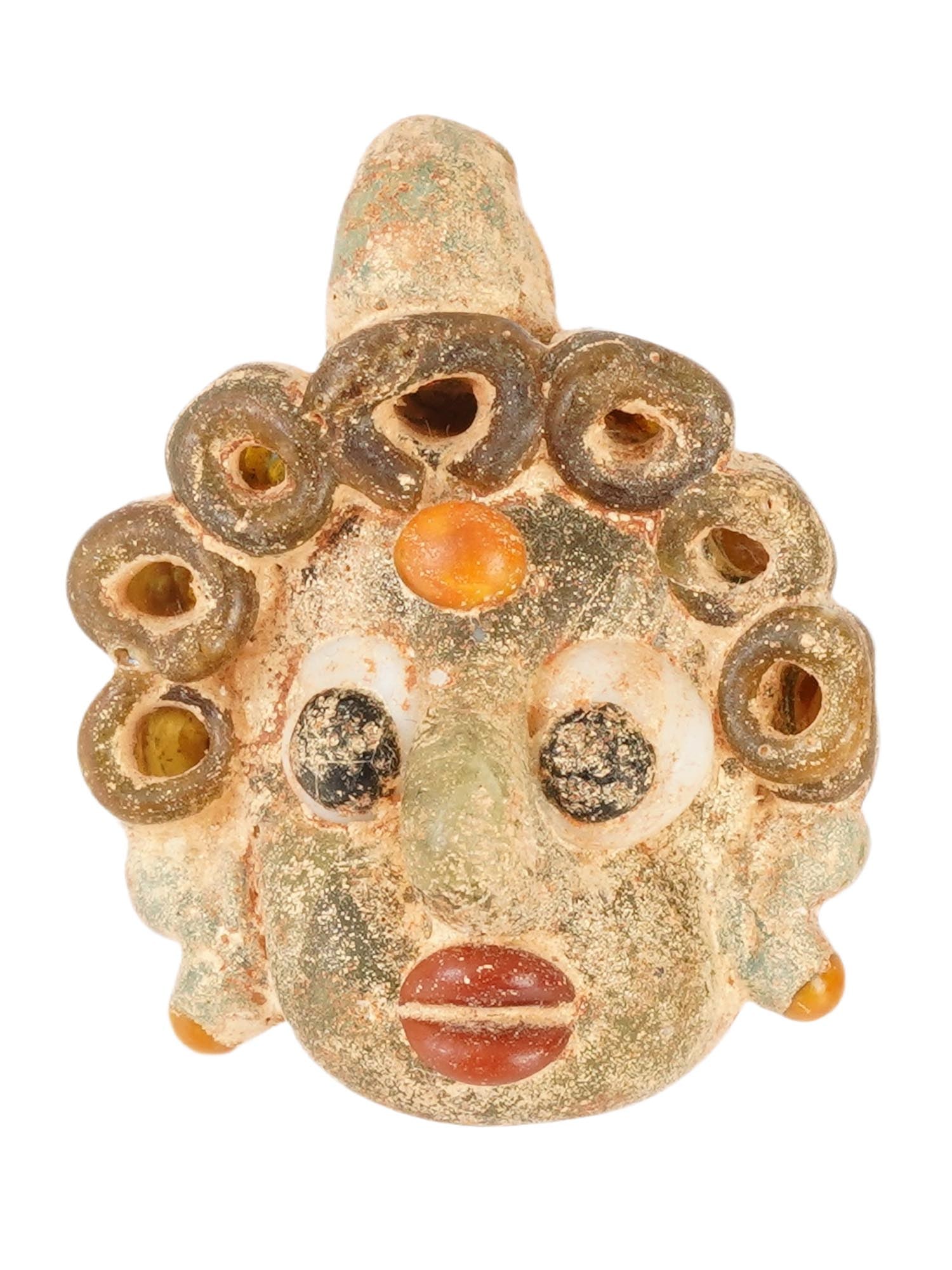 ANCIENT HOLY LAND MOSAIC GLASS HEAD AMULET PENDANT: An ancient Holy Land multicolored mosaic glass amulet pendant, artfully crafted in the shape of a head. Circa 300 to 100 BC. This remarkable artifact showcases the remarkable artistry and cultural sig