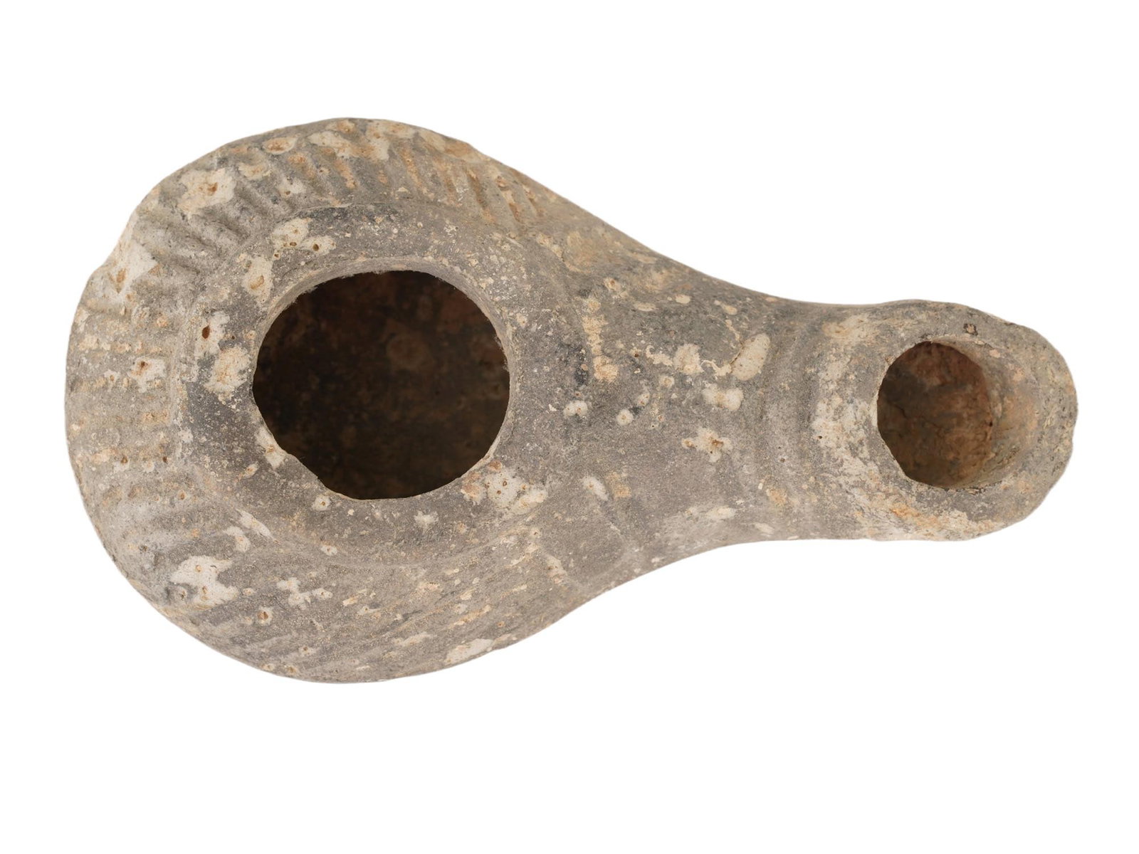 ANCIENT HELLENISTIC PERIOD EROTIC TERRACOTTA OIL LAMP: An ancient Hellenistic period terracotta oil lamp featuring an erotic design with a protruding nose. Decorated with a line pattern to the base. Circa: 300 to 100 BC. Made of unglazed clay. Historical