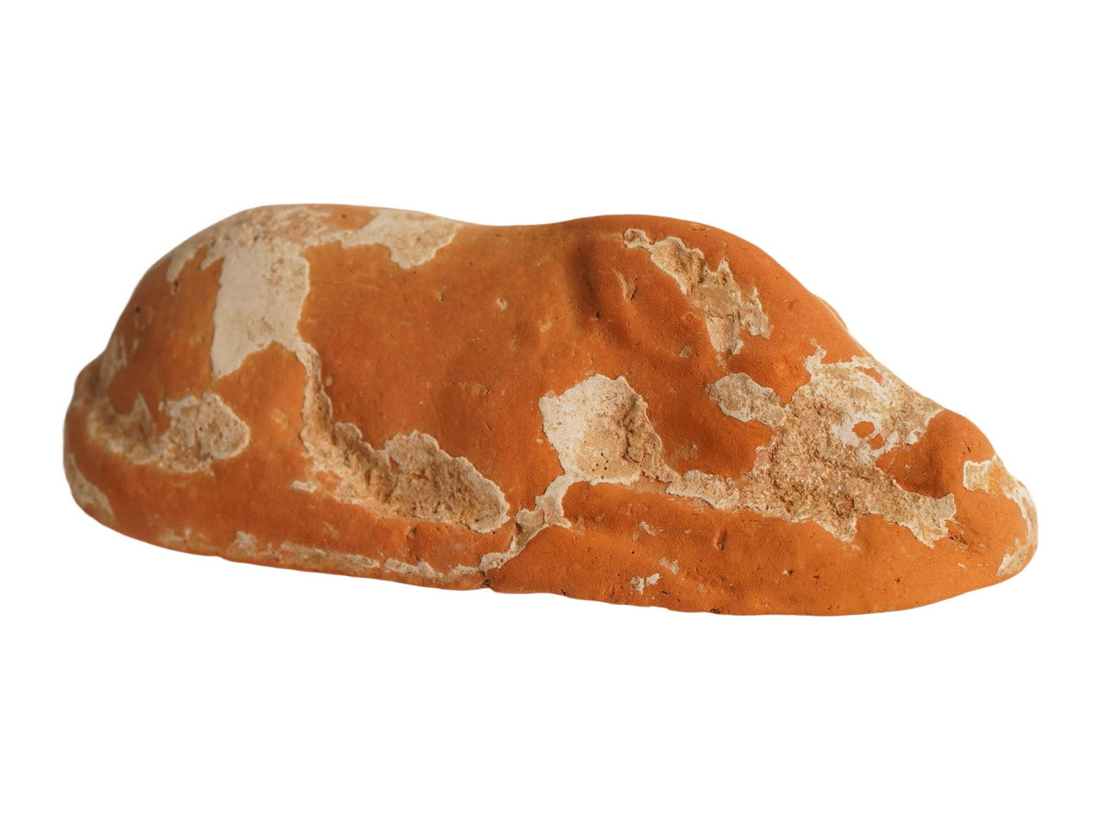 ANCIENT HOLY LAND TERRACOTTA PIG FIGURINE: An ancient Holy land terracotta pig figurine, dating from 200 BC to 200 AD. The figurine depicts a lying pig with smooth outlines on an oval base. Ancient Terracotta Sculptures, Figures, Figurines And