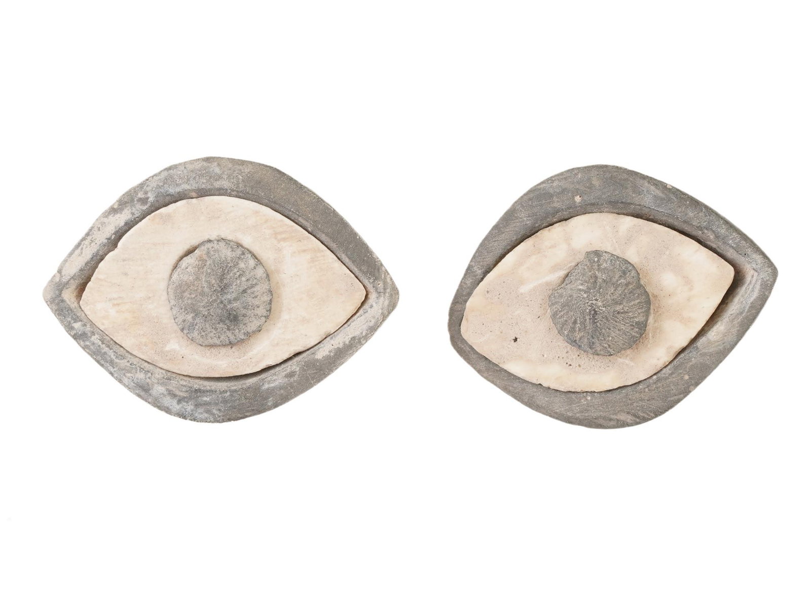 ANCIENT NEAR EASTERN STEATITE EYES OF SEPARATE PARTS: A pair of ancient Near Eastern carved steatite eyes. Each eye consists of three separate parts: the iris, sclera, and eyelids, showcasing intricate craftsmanship and attention to detail. Ancient Carve