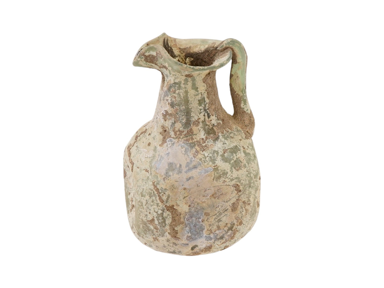ANCIENT ROMAN DUCK SPOUT GLASS PITCHER 100 TO 300 AD: An intact ancient Roman glass pitcher, dating from 100 to 300 AD. The pitcher has a prolonged form with a handle connecting the neck and body. The spout is made in a duck form design. Ancient Roman Gl