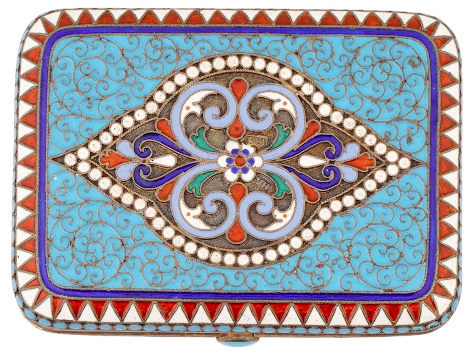 RUSSIAN GILT SILVER CLOISONNE ENAMEL CIGARETTE CASE: A Russian gilt silver enamel cigarette case. Features vibrant cloisonne enamel decorations with a light blue ground and wirework forming stylized floral motifs. The rectangular form is adorned by a ce