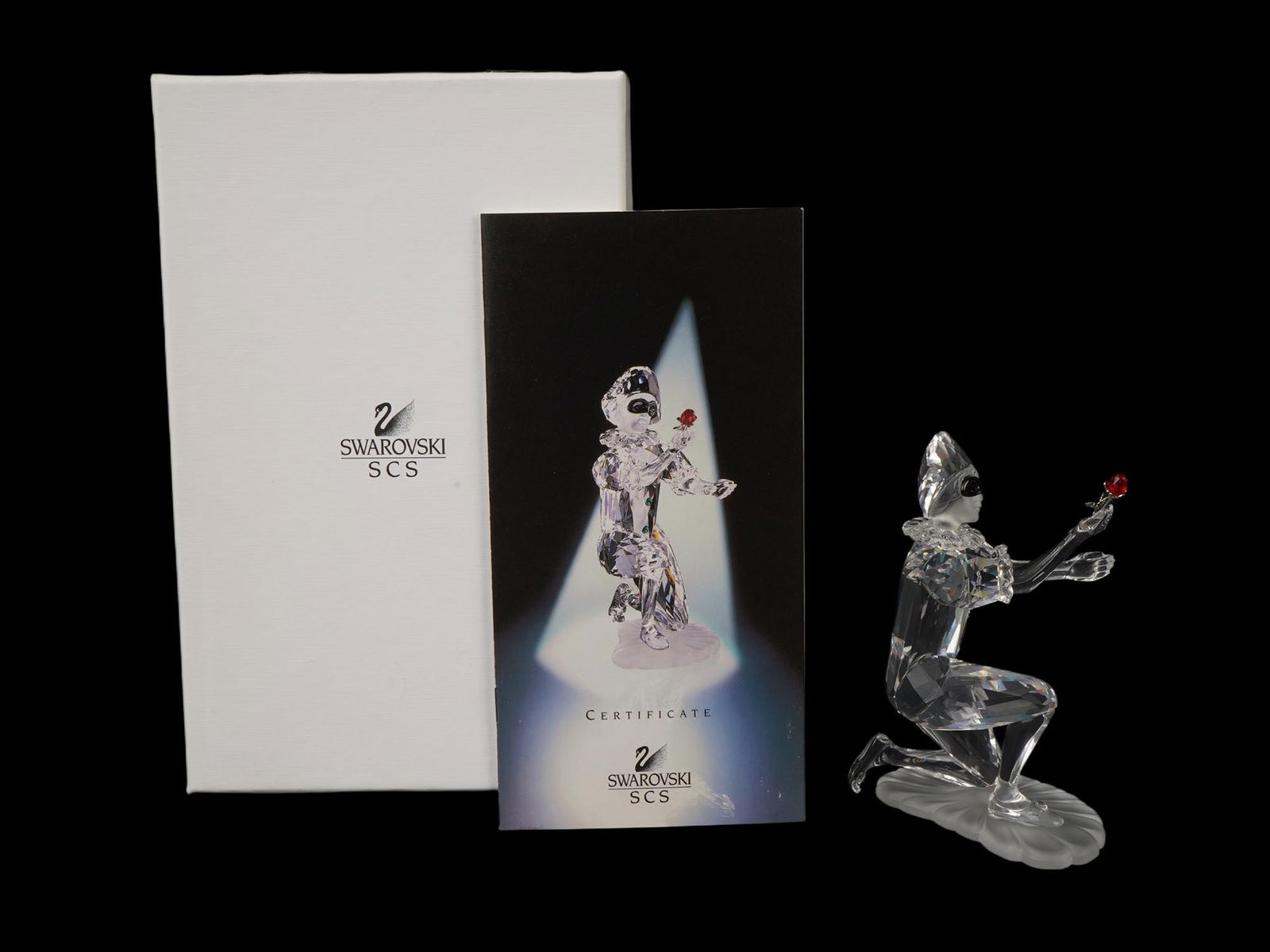 2001 SWAROVSKI SCS CRYSTAL FIGURINE HARLEQUIN IOB: A Swarovski crystal figurine Harlequin, released in 2001 as part of an annual series for Swarovski Collectors Club SCS members, was the final, third installment in the Masquerade trilogy. Mounted on a