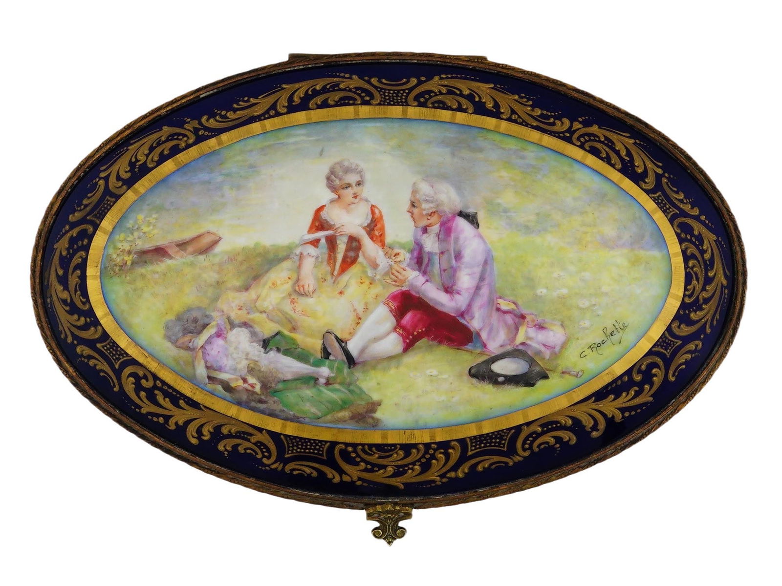 ANTIQUE FRENCH SEVRES PORCELAIN JEWELRY CASKET: An antique French Sevres porcelain jewelry casket, dating to the late 19th century, distinguished by its cobalt blue ground and ornate gilt mounts. The lid features a hand-painted courting scene in 18
