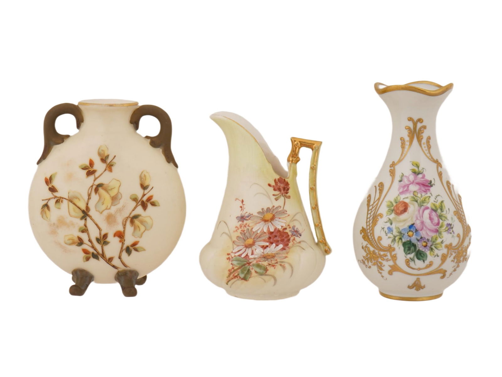 THREE EUROPEAN ANTIQUE AND VINTAGE PORCELAIN VASES: A group of three antique and vintage porcelain vases. The items share a common aesthetic of hand-painted floral motifs and extensive gilded detailing. A flattened, oval-shaped pillow vase resting on f