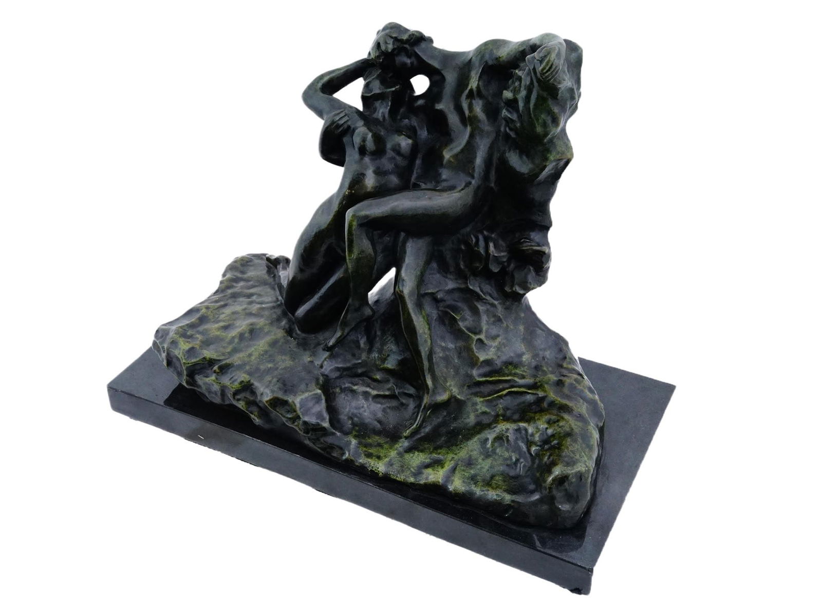AFTER AUGUSTE RODIN FRENCH SCULPTURE ETERNAL SPRINGTIME: After Auguste Rodin, French, 1840 to 1917, a cast bronze sculpture Eternal Springtime. The composition depicts two nude figures in a passionate embrace, emerging from a rough-hewn, rocky outcrop. Arti
