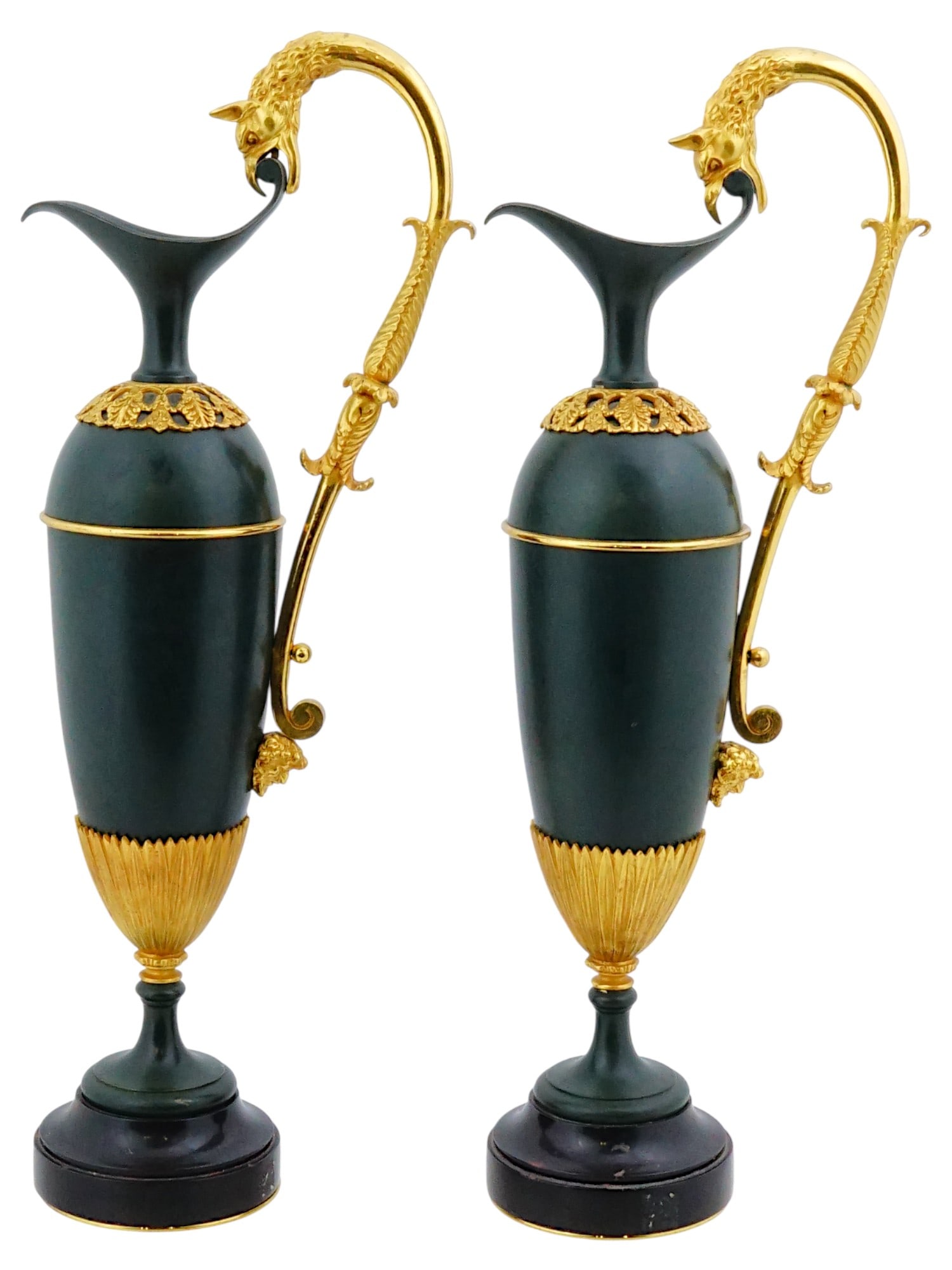 PAIR OF ANTIQUE FRENCH CLAUDE GALLE MANNER BRONZE EWERS: A pair of antique 19th century French Empire style patinated and gilt bronze ewers in the manner of Claude Galle, 1758 to 1815. The dark, matte finish of the bodies provides a sharp contrast to the br