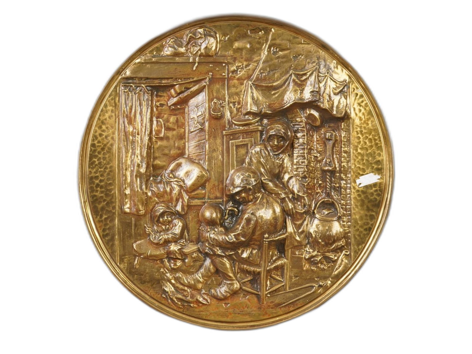 VINTAGE BELGIAN GILT BRASS GENRE SCENE PLAQUE: A vintage Belgian relief gilt brass plaque. The round plaque depicts a genre scene with a peasant family in an interior setting. On the reverse side, the holder is marked Made in Belgium and numbered