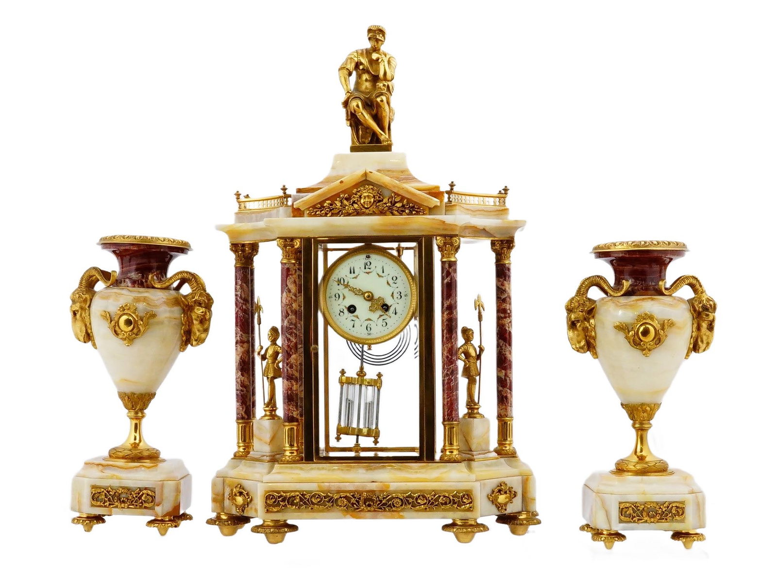 ANTIQUE FRENCH EMPIRE CLOCK VASES GARNITURE SET: An antique French Empire style mantle garniture consisting of a clock and two urn-form vases crafted in the Louis XVI taste. The clock is made of ormolu bronze and white onyx, architectural in shape w