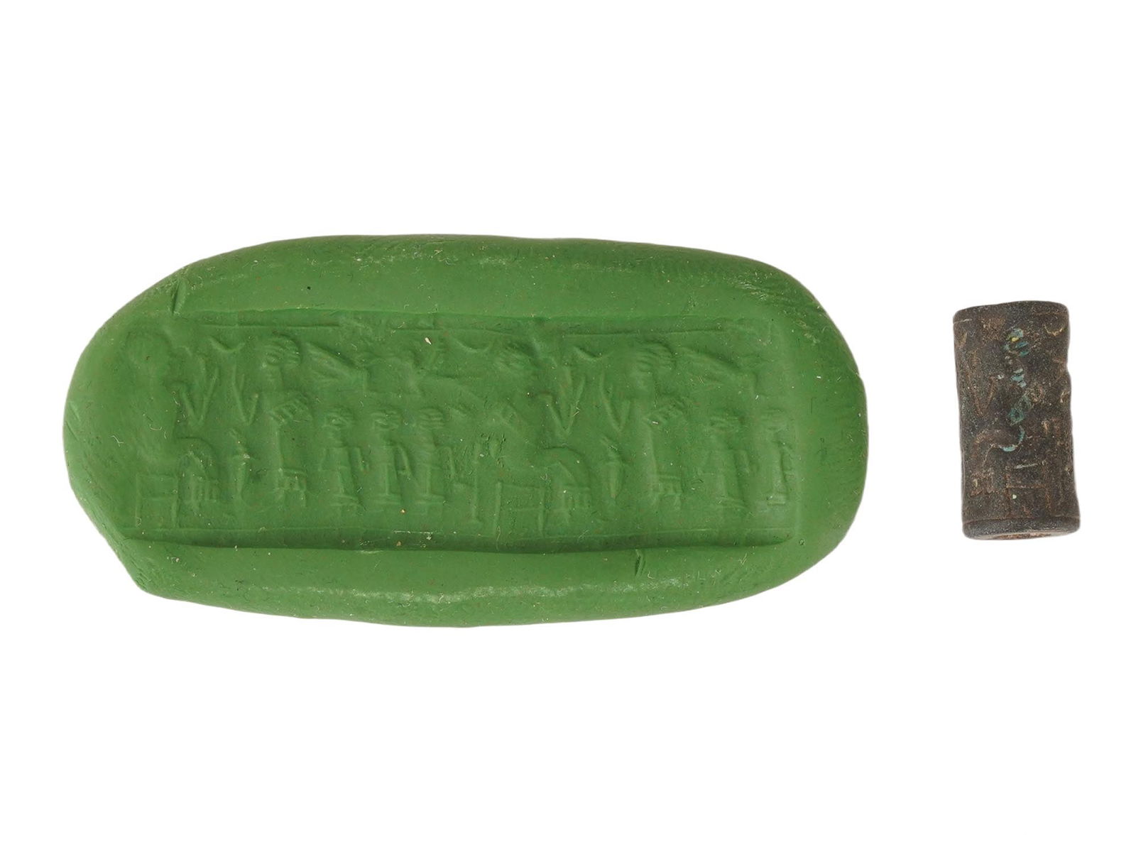 ANCIENT WESTERN ASIATIC ENGRAVED CYLINDER STONE SEAL: An ancient Western Asiatic cylinder stone seal bead with an engraved image of a ritual with human figures. Circa the 1st millennium BC. Collectible Historical Artifacts, Archaeological Finds And Relic