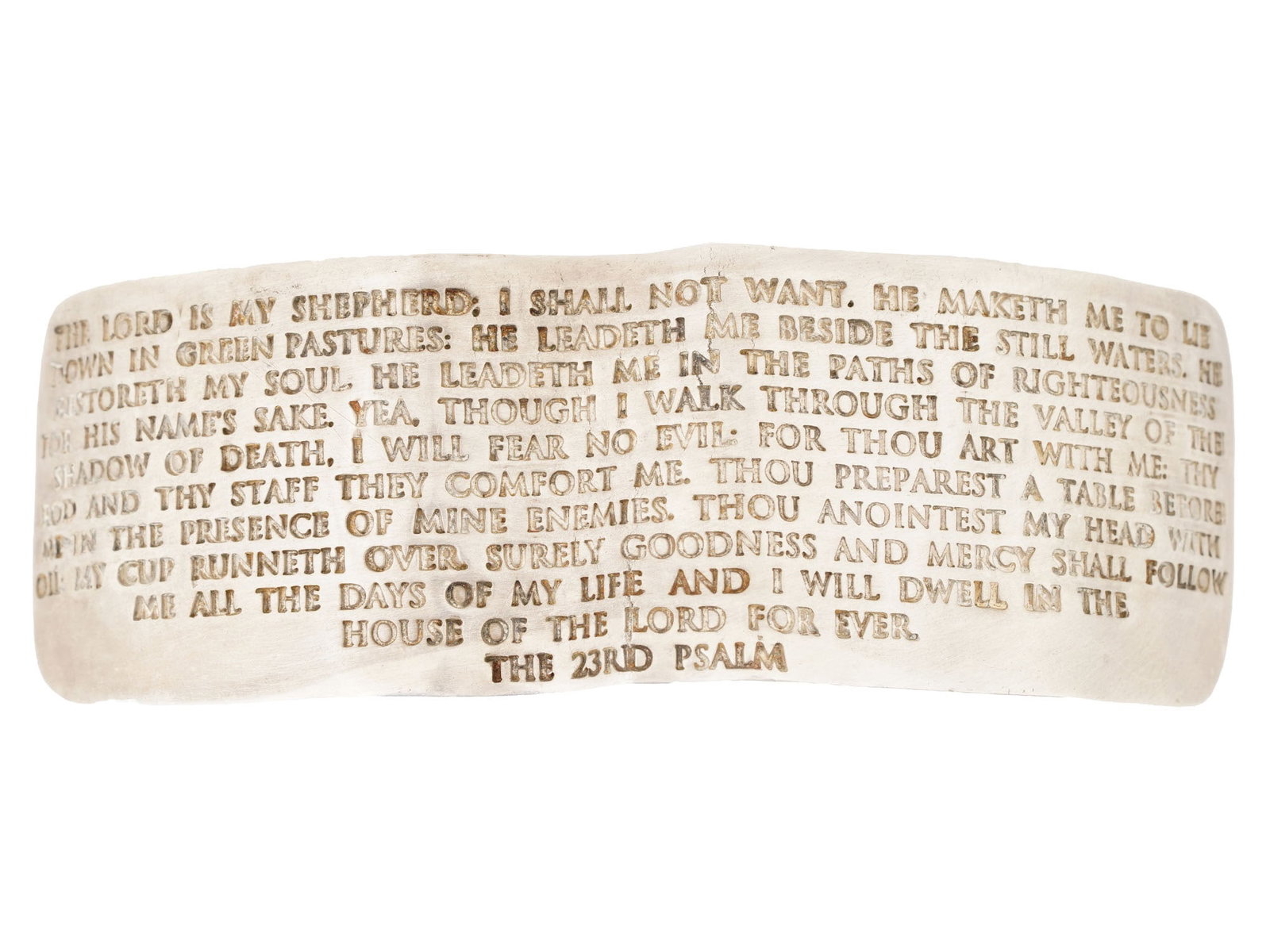 VINTAGE RELIGIOUS STERLING SILVER CUFF BRACELET: A vintage sterling silver cuff bracelet features a heavily textured exterior and an interior surface meticulously engraved with the complete text of the 23rd Psalm. Stamped with a 925 fineness mark an