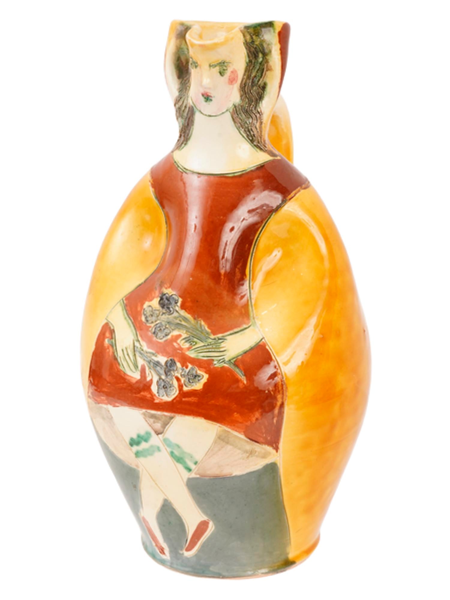 MODERN HAND PAINTED POTTERY VASE BY PIERRE ROULOT: A pottery vase by Pierre Roulot, crafted in a modern style. The figural design depicts a woman in a red dress holding a bouquet of flowers. Executed in glazed pottery with hand-painted detail, inscrib