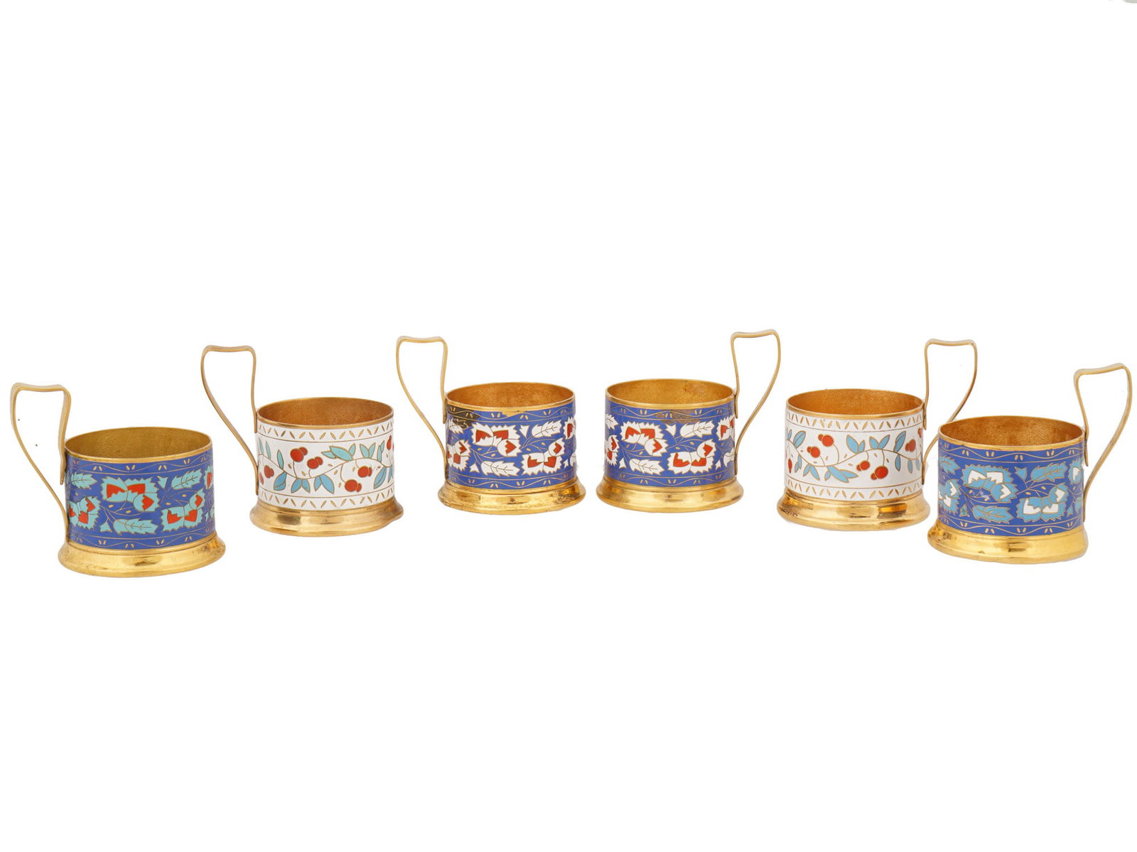 SET OF SIX RUSSIAN CLOISONNE ENAMEL GLASS HOLDERS: A set of six Russian glass holders, or podstakanniks, decorated with vibrant cloisonne enamel. Each holder features a cylindrical body adorned with intricate polychrome foliate and geometric patterns