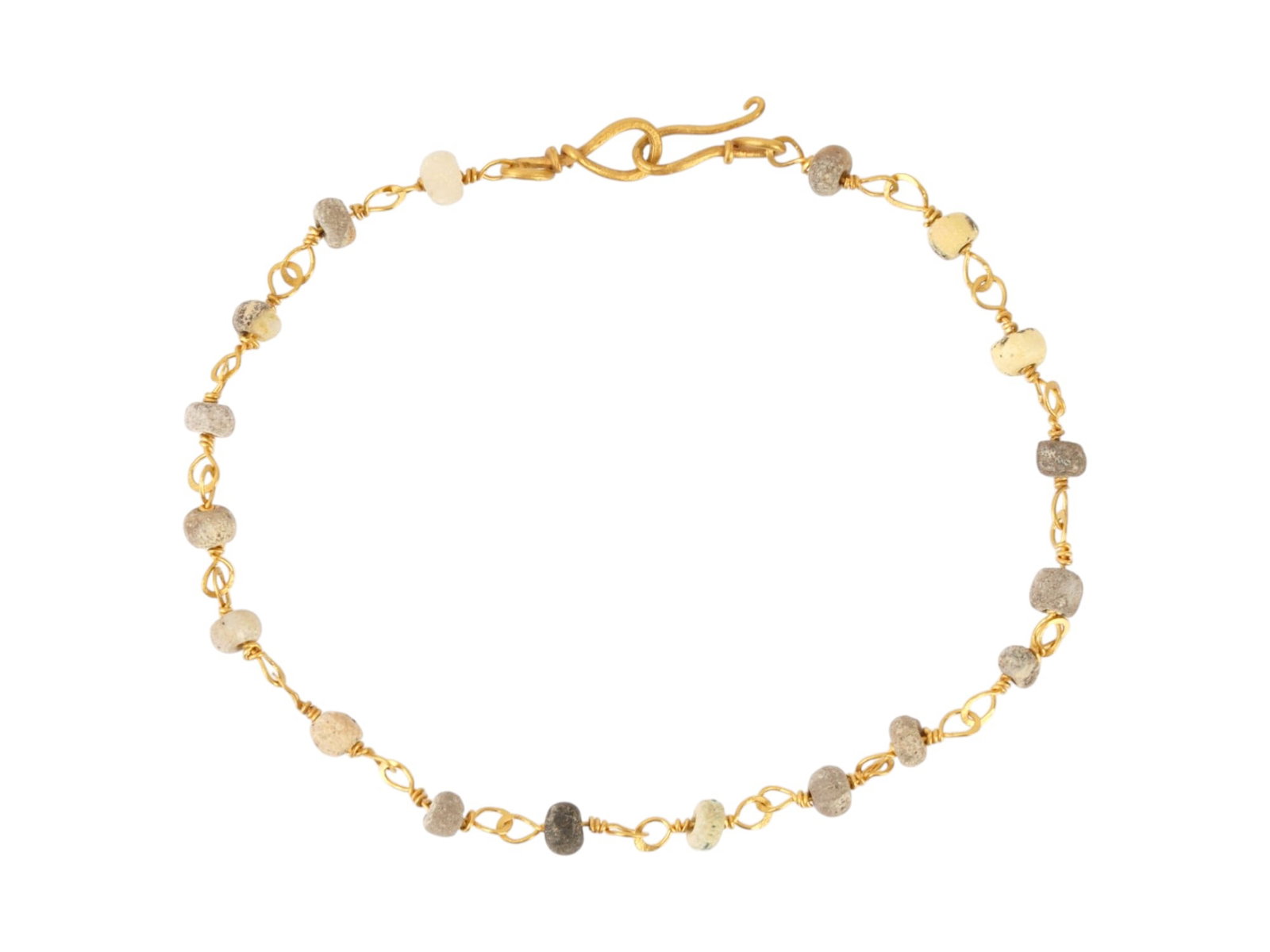 ANCIENT ROMAN GOLD BRACELET W GLASS BEADS 100 TO 300 AD: An ancient Roman Gold bracelet. The bracelet is made in a chain design and decorated with glass beads. A hook clasp. Circa: 100 to 300 AD. Ancient Roman Gold and Glass Jewelry Wares and Accessories, M