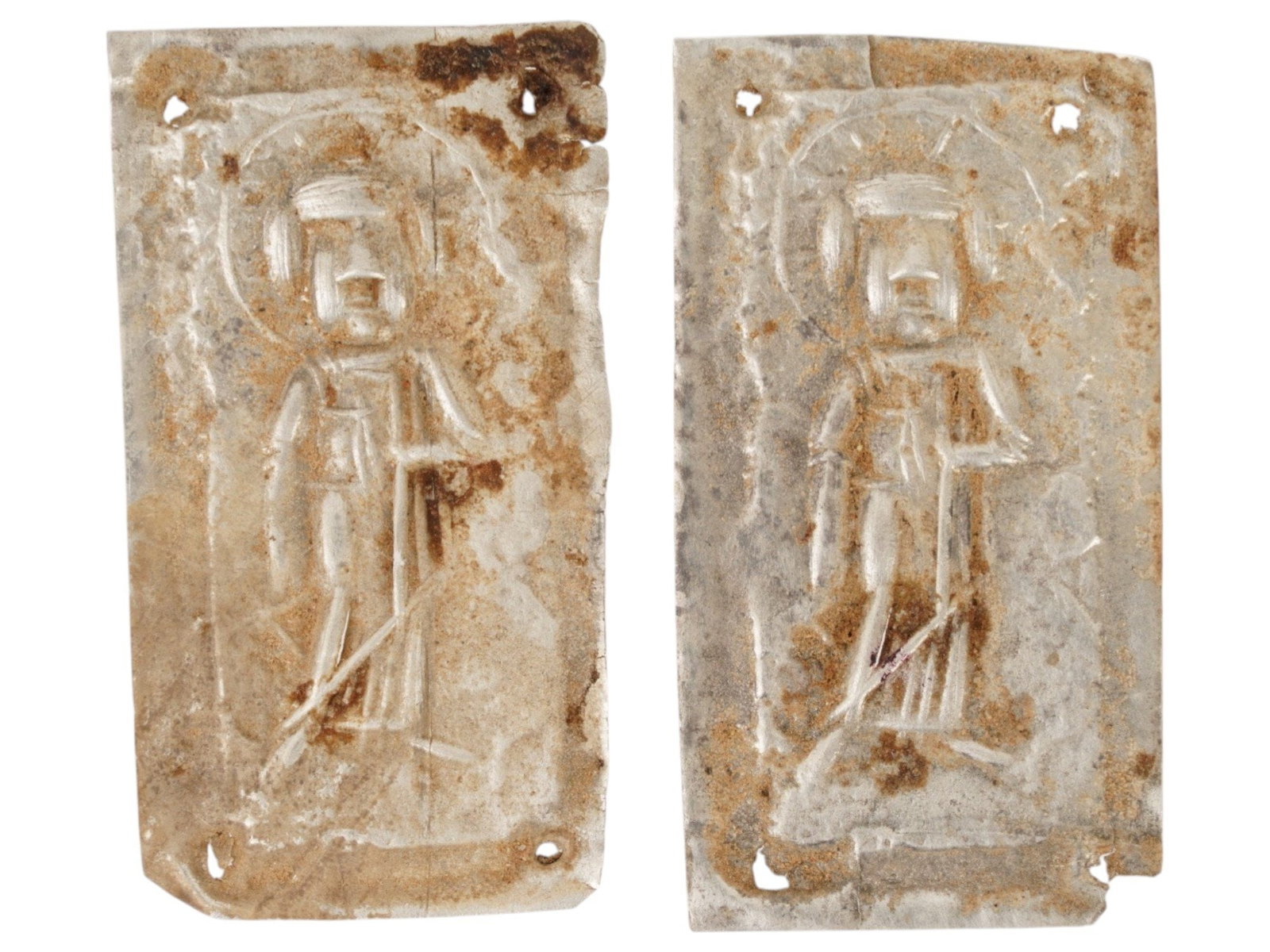 TWO BYZANTINE SILVER VOTIVE JESUS PLAQUES 400 TO 600 AD: A pair of Byzantine silver votive plaques, circa 400 to 600 AD, represents an early form of personal Christian art. These plaques were likely intended to be sewn onto garments or attached to small dev