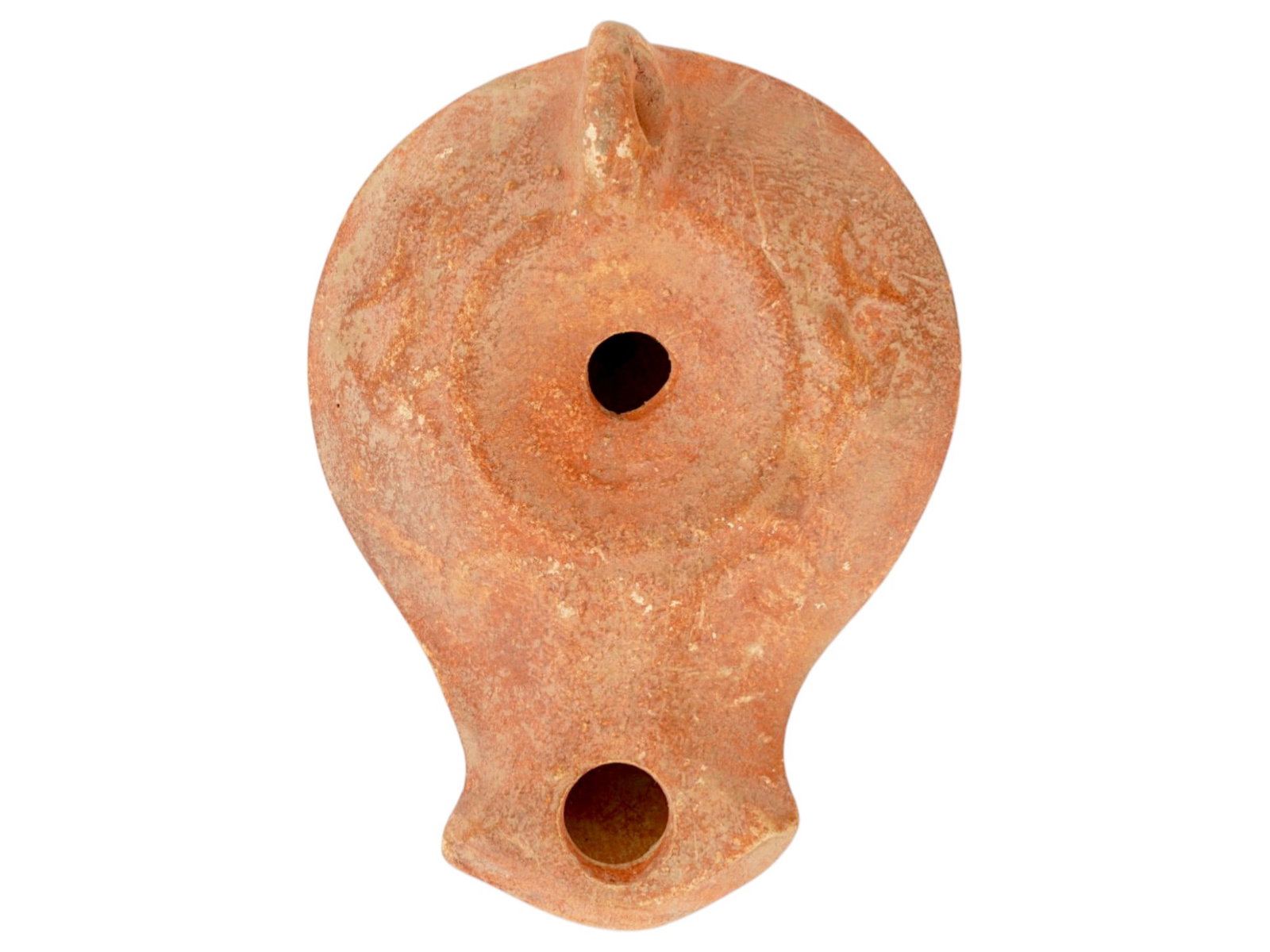 ANCIENT ROMAN TERRACOTTA OIL LAMP 100 TO 300 AD: An ancient Roman painted terracotta pottery oil lamp. The body of the lamp is adorned with engraved ornaments on the shoulders. The lamp is decorated with a raised circle nozzle top and a raised handl